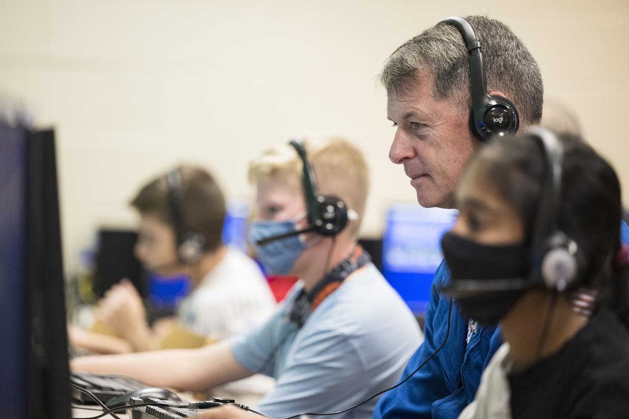 NASA’s SpaceX Crew-2 NASA astronaut Shane Kimbrough surveys what students in the tech crew in the Space Shuttle Simulator room are doing during a visit to Arlington Science Focus Elementary School, Friday, June 10, 2022, in Arlington, Virginia. Photo Credit: (NASA/Aubrey Gemignani)
