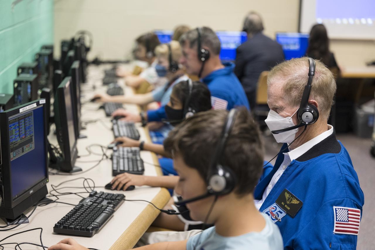 NASA Administrator Bill Nelson surveys what students in the tech crew in the Space Shuttle Simulator room are doing during a visit to Arlington Science Focus Elementary School, Friday, June 10, 2022, in Arlington, Virginia. Photo Credit: (NASA/Aubrey Gemignani)