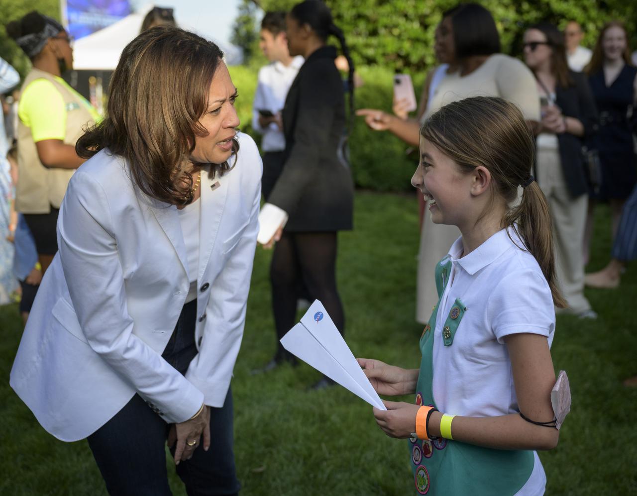 Vice President Kamala Harris talks with children as they participate in hands-on STEM activities on the grounds of the Vice President's residence at the Naval Observatory, Friday, June 17, 2022, in Washington. The Vice President and Second Gentleman hosted an evening of NASA STEM activities at the Naval Observatory for military families and local STEM students and their families, including a special screening of Disney Pixar’s Lightyear. Photo Credit: (NASA/Bill Ingalls)