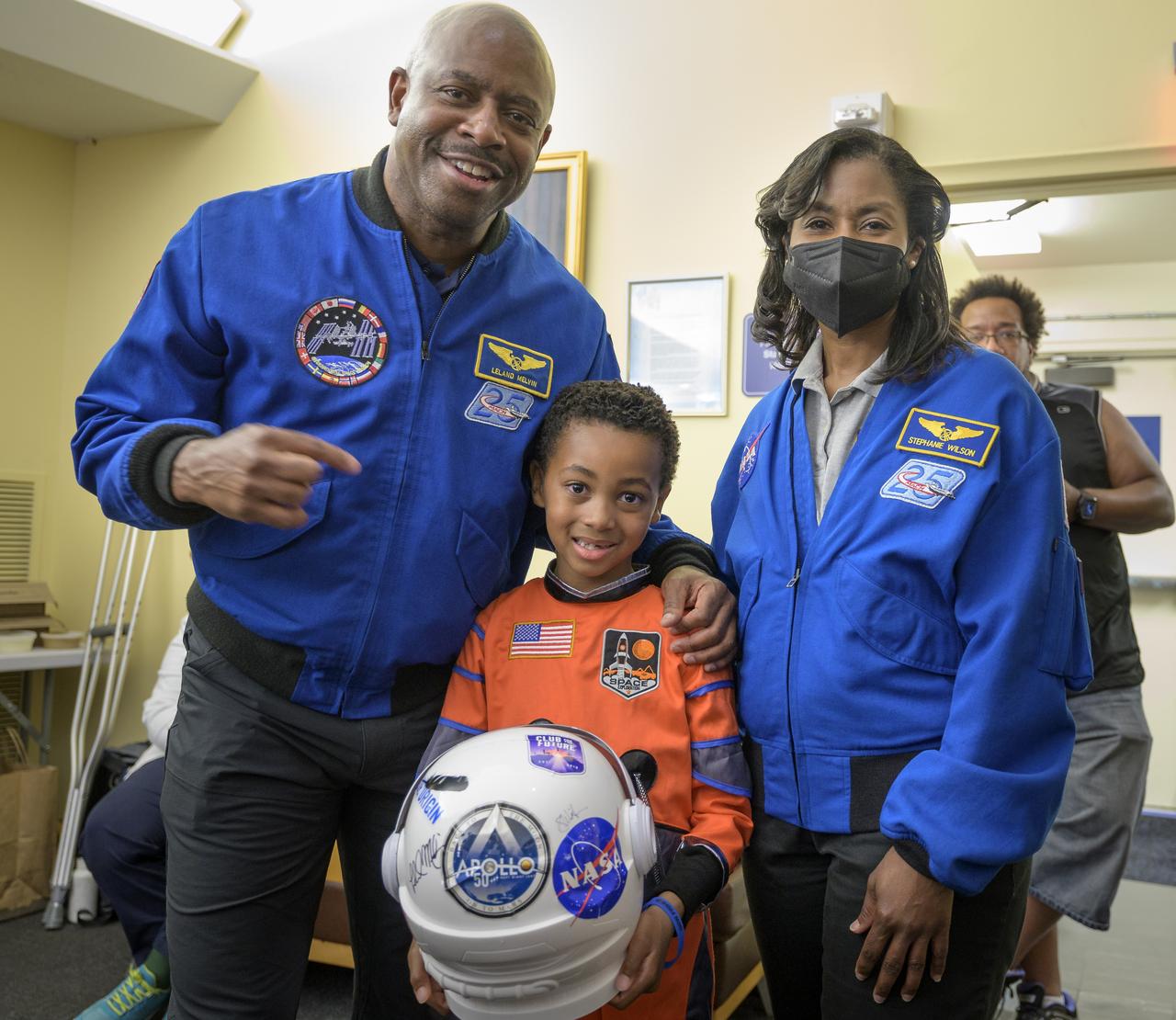Former NASA astronaut Leland Melvin, left, and NASA astronaut Stephanie Wilson, pose for photograph with 6-year old Armani Bonds prior to the screening of the NASA produced documentary “The Color of Space” at Howard University’s Cramton Auditorium in Washington, Saturday, June 18, 2022. Premiering on Juneteenth, the federal holiday commemorating the end of slavery in the United States, “The Color of Space” is an inspirational documentary that tells the stories of NASA’s Black astronauts determined to reach the stars. Photo Credit: (NASA/Bill Ingalls)