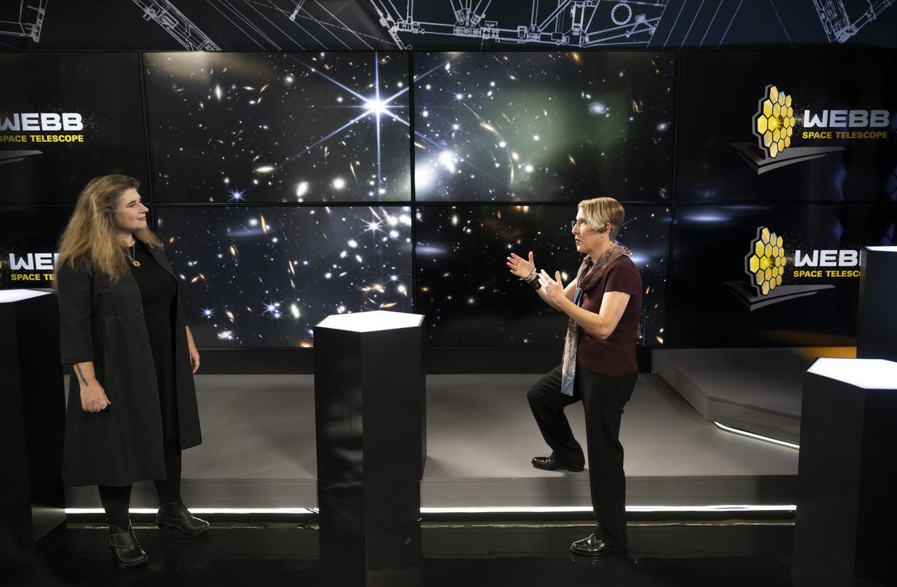 Assistant Director of Science at NASA's Goddard Space Flight Center Michelle Thaller, left, speaks with NASA James Webb Space Telescope Operations Project Scientist Jane Rigby, right, about the Webb Deep Field image as it is shown on screen during a broadcast releasing the telescope’s first full-color images, Tuesday, July 12, 2022, at NASA’s Goddard Space Flight Center in Greenbelt, Md.  The first full-color images and spectroscopic data from the James Webb Space Telescope, a partnership with ESA (European Space Agency) and the Canadian Space Agency (CSA), are a demonstration of the power of Webb as the telescope begins its science mission to unfold the infrared universe. Photo Credit: (NASA/Bill Ingalls)