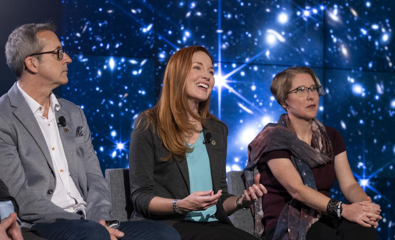 NASA James Webb Space Telescope Deputy Project Scientist for Communications Amber Straughn, center, answers a question from a member of the media alongside Principal Investigator for the Canadian Near-Infrared Imager and Slitless Spectrograph at the University of Montreal René Doyon, left, and NASA James Webb Space Telescope Operations Project Scientist Jane Rigby, right, during a briefing following the release of the first full-color images from NASA’s James Webb Space Telescope, Tuesday, July 12, 2022, at NASA’s Goddard Space Flight Center in Greenbelt, Md.  The first full-color images and spectroscopic data from the James Webb Space Telescope, a partnership with ESA (European Space Agency) and the Canadian Space Agency (CSA), are a demonstration of the power of Webb as the telescope begins its science mission to unfold the infrared universe. Photo Credit: (NASA/Bill Ingalls)