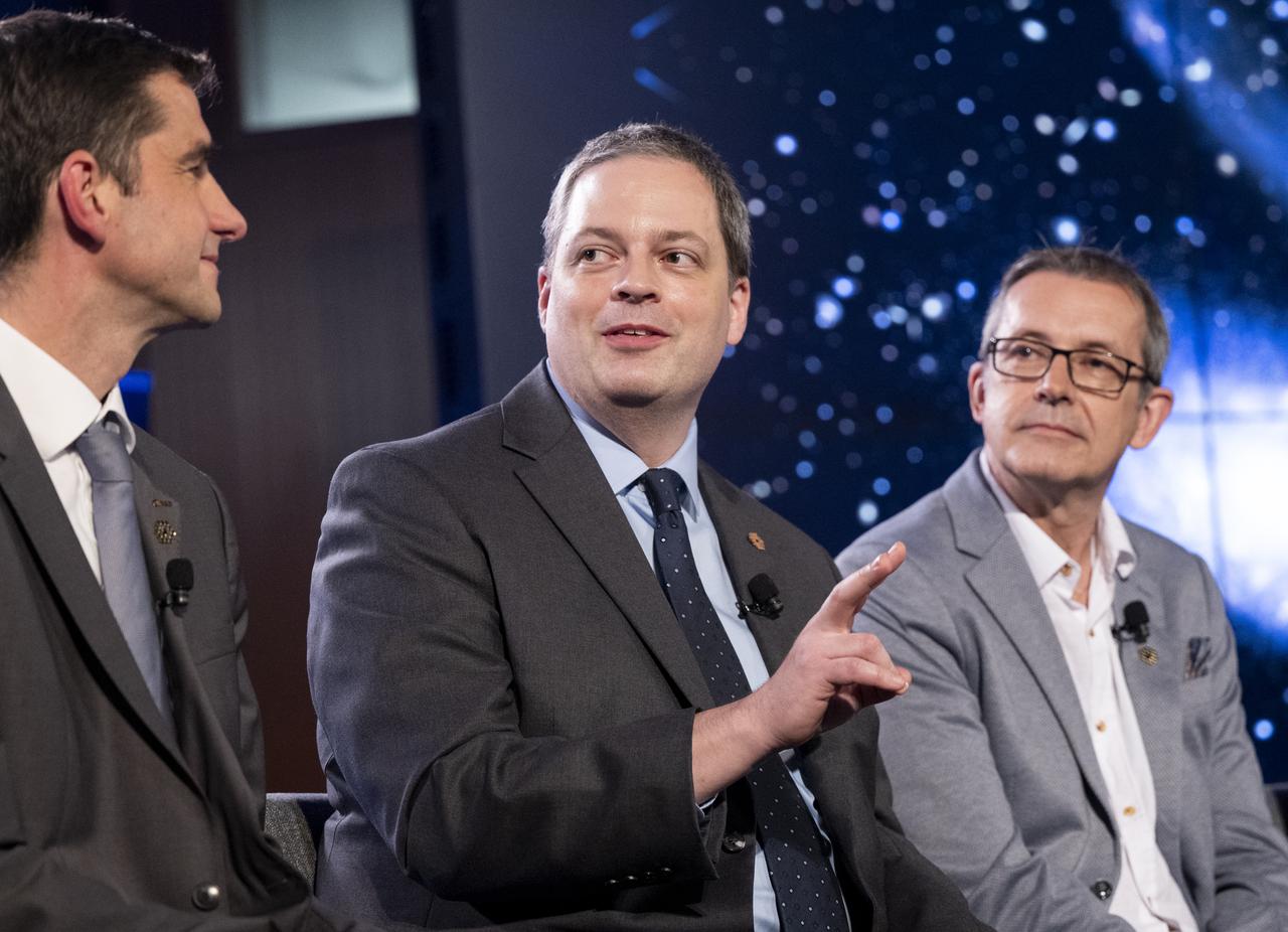 NASA James Webb Space Telescope Project Scientist, Space Telescope Science Institute, Klaus Pontoppidan, center, answers a question from a member of the media alongside NASA James Webb Space Telescope Project Scientist at ESA (European Space Agency) Christopher Evans, left, and Principal Investigator for the Canadian Near-Infrared Imager and Slitless Spectrograph at the University of Montreal René Doyon, right, during a briefing following the release of the first full-color images from NASA’s James Webb Space Telescope, Tuesday, July 12, 2022, at NASA’s Goddard Space Flight Center in Greenbelt, Md.  The first full-color images and spectroscopic data from the James Webb Space Telescope, a partnership with ESA (European Space Agency) and the Canadian Space Agency (CSA), are a demonstration of the power of Webb as the telescope begins its science mission to unfold the infrared universe. Photo Credit: (NASA/Bill Ingalls)