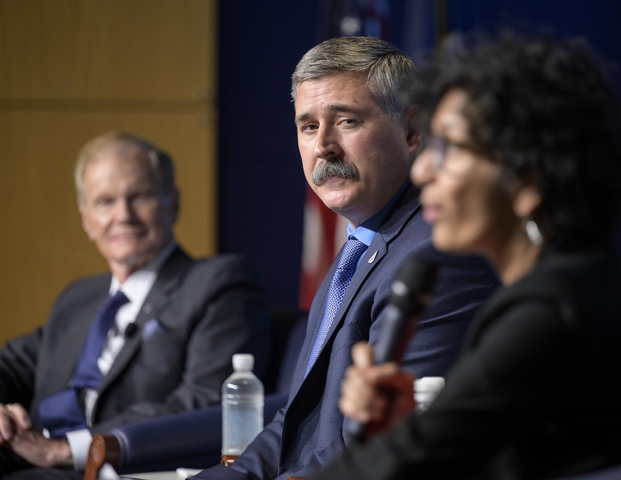 Mike Sarafin, Artemis I mission manager at NASA Headquarters listens as Bhavya Lal, associate administrator for technology, policy, and strategy at NASA Headquarters speaks during a NASA briefing on the Artemis I Moon mission, Wednesday, Aug. 3, 2022, at the Mary W. Jackson NASA Headquarters building in Washington. NASA’s Artemis I mission is the first integrated test of the agency’s deep space exploration systems: the Orion spacecraft, Space Launch System rocket, and supporting ground systems. Launch of the uncrewed flight test is targeted for no earlier than Monday, Aug. 29. Photo Credit: (NASA/Bill Ingalls)