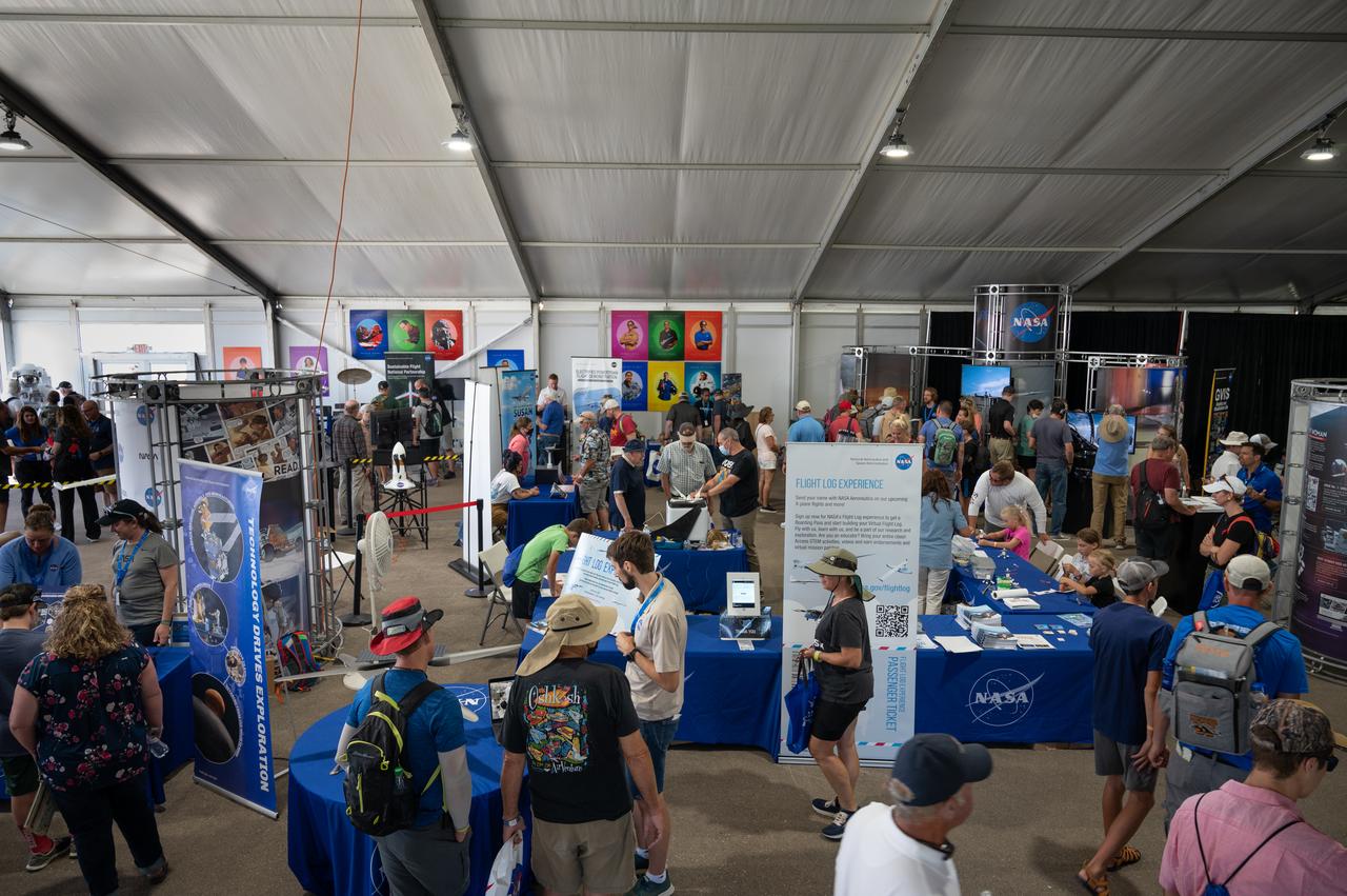 Attendees visit the NASA pavilion at AirVenture on Wednesday, July 27, 2022.