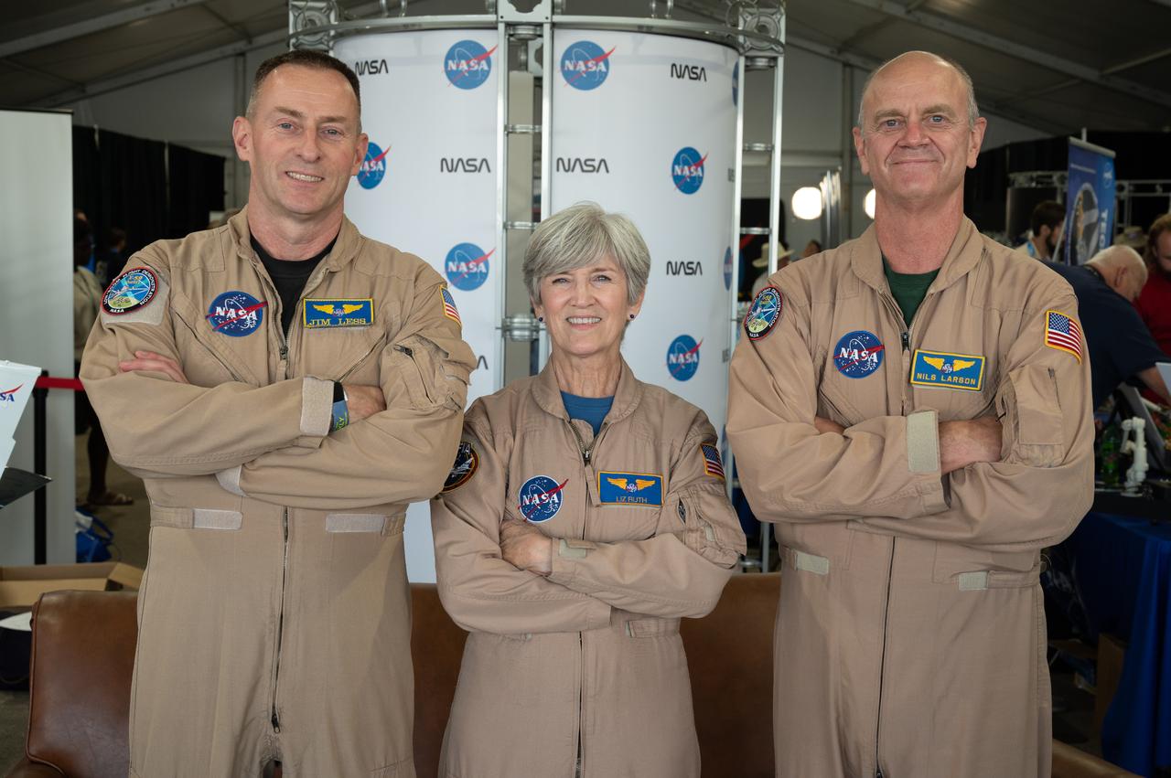 NASA pilots Jim Less, Liz Ruth and Nils Larson pose for a photo on Friday, July 28, 2022, during a meet and greet session in the NASA pavilion at AirVenture Oshkosh.