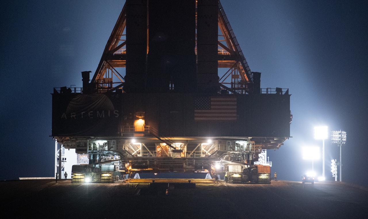 NASA’s Space Launch System (SLS) rocket with the Orion spacecraft aboard is seen atop the mobile launcher as it rolled up the ramp at Launch Pad 39B by Crawler-Transporter 2, Wednesday, Aug. 17, 2022, at NASA’s Kennedy Space Center in Florida. NASA’s Artemis I mission is the first integrated test of the agency’s deep space exploration systems: the Orion spacecraft, SLS rocket, and supporting ground systems. Launch of the uncrewed flight test is targeted for no earlier than Aug. 29. Photo Credit: (NASA/Joel Kowsky)