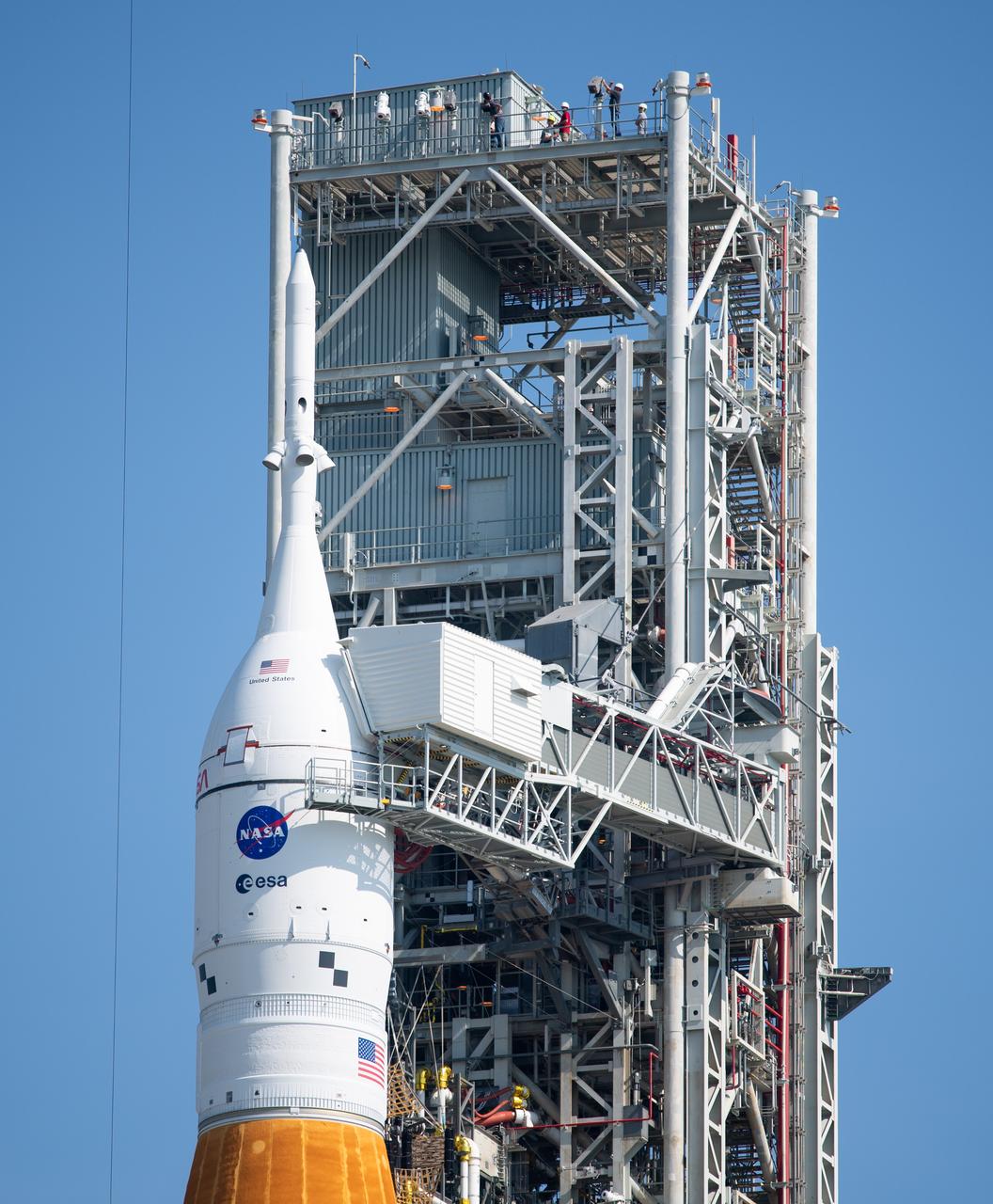 NASA’s Space Launch System (SLS) rocket with the Orion spacecraft aboard is seen atop a mobile launcher at Launch Pad 39B, Thursday, Aug. 18, 2022, after being rolled out to the launch pad at NASA’s Kennedy Space Center in Florida. NASA’s Artemis I mission is the first integrated test of the agency’s deep space exploration systems: the Orion spacecraft, SLS rocket, and supporting ground systems. Launch of the uncrewed flight test is targeted for no earlier than Aug. 29. Photo Credit: (NASA/Joel Kowsky)