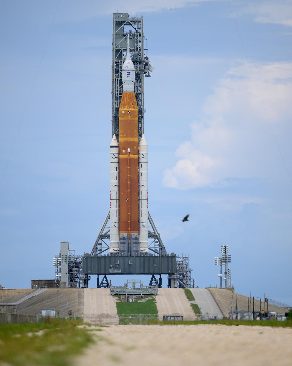 NASA’s Space Launch System (SLS) rocket with the Orion spacecraft aboard is seen atop a mobile launcher at Launch Pad 39B as preparations for launch continue, Sunday, Aug. 28, 2022, at NASA’s Kennedy Space Center in Florida. NASA’s Artemis I flight test is the first integrated test of the agency’s deep space exploration systems: the Orion spacecraft, SLS rocket, and supporting ground systems. Launch of the uncrewed flight test is targeted for no earlier than Aug. 29 at 8:33 a.m. ET.  Photo Credit: (NASA/Bill Ingalls)