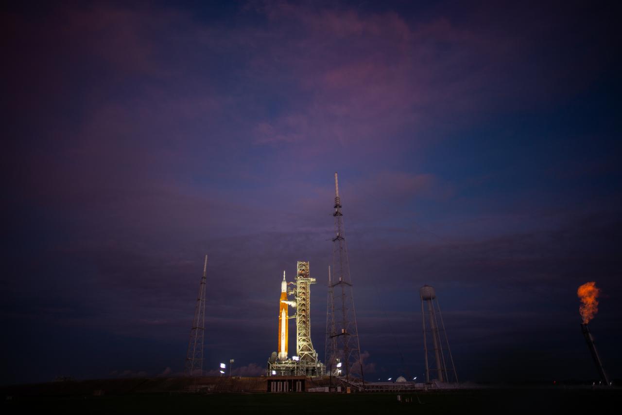NASA’s Space Launch System (SLS) rocket with the Orion spacecraft aboard is seen atop the mobile launcher at Launch Pad 39B during the first launch attempt, Monday, Aug. 29, 2022, as the Artemis I launch teams load more than 700,000 gallons of cryogenic propellants including liquid hydrogen and liquid oxygen as the launch countdown progressed at NASA’s Kennedy Space Center in Florida. NASA’s Artemis I flight test is the first integrated test of the agency’s deep space exploration systems: the Orion spacecraft, SLS rocket, and supporting ground systems. Launch of the uncrewed flight test is targeted for Sept. 3 at 2:17 p.m. EDT.  Photo Credit: (NASA/Joel Kowsky)