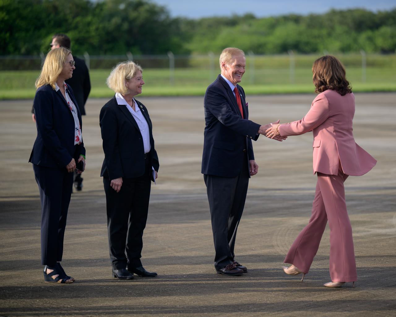 NASA Kennedy Space Center director Janet Petro, left, NASA Deputy Administrator Pam Melroy, and NASA Administrator Bill Nelson,  welcome Vice President Kamala Harris as she arrives at the Launch and Landing Facility at NASA’s Kennedy Space Center ahead of the planned launch of Artemis I, Monday, Aug. 29, 2022, in Florida. NASA’s Artemis I flight test is the first integrated flight test of the agency’s deep space exploration systems: the Orion spacecraft, Space Launch System (SLS) rocket, and ground systems.  Photo Credit: (NASA/Bill Ingalls)