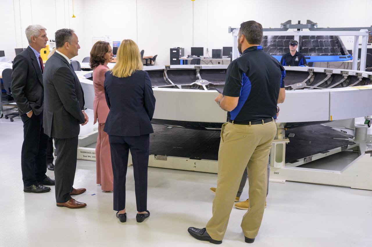 Vice President Kamala Harris is shown the Artemis II flight heat shield, during a visit, Monday, Aug. 29, 2022, at the Neil  A. Armstrong Operations and Checkout Building at NASA’s Kennedy Space Center in Florida. Photo Credit: (NASA/Bill Ingalls)