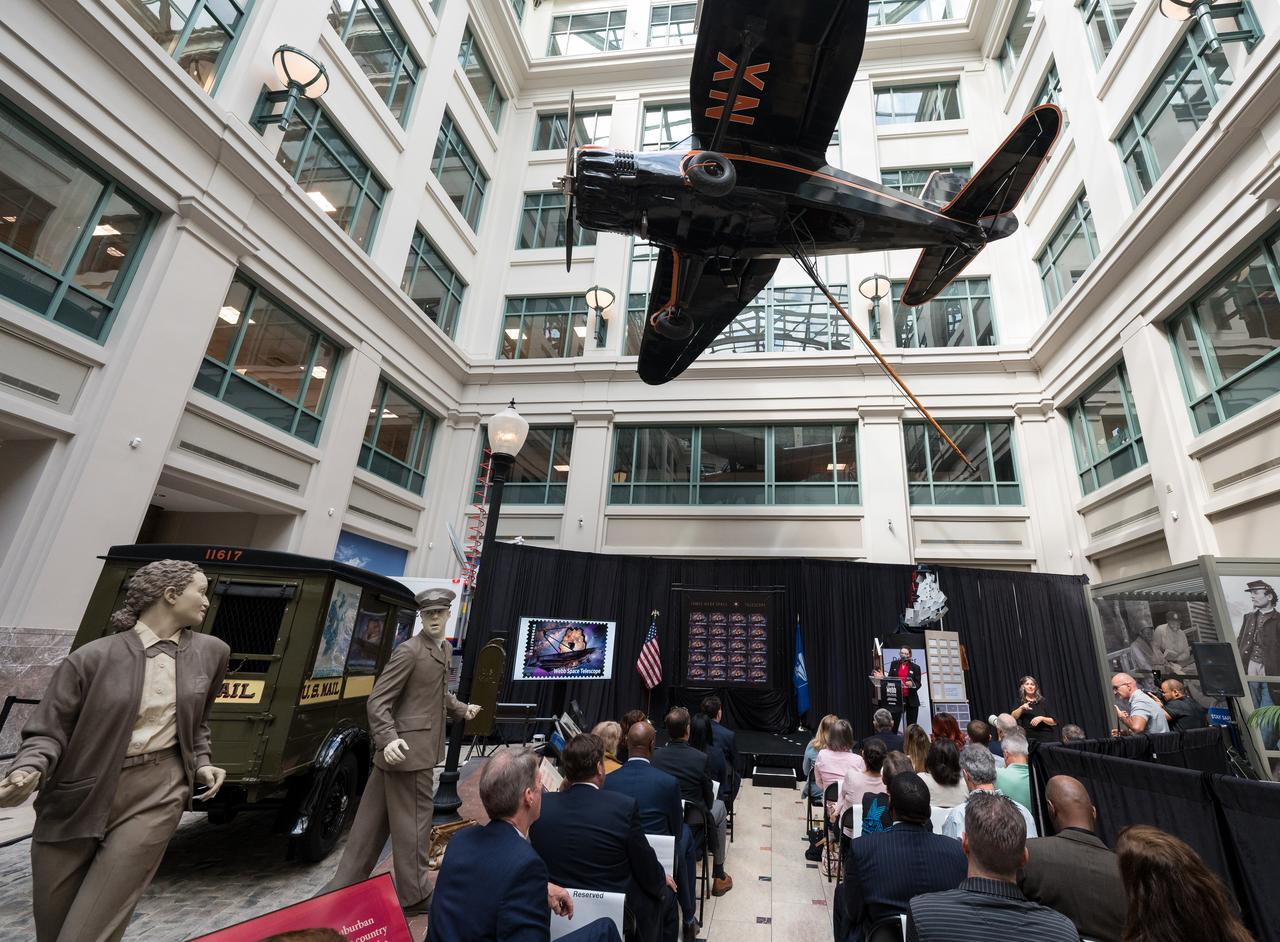 NASA’s Goddard Space Flight Center Webb Deputy Observatory Project Scientist, Erin Smith, provides remarks at the first-day-of-issue event for the United States Postal Service’s new stamp celebrating NASA’s James Webb Space Telescope (JWST) on Thursday, Sept. 8, 2022, at the Smithsonian’s National Postal Museum in Washington. The stamp, which features an illustration of the observatory, honors Webb’s mission to explore the unknown in our universe – solving mysteries in our solar system, looking beyond to distant worlds around other stars, and probing the structures and origins of our universe and our place in it. Photo Credit: (NASA/Aubrey Gemignani)