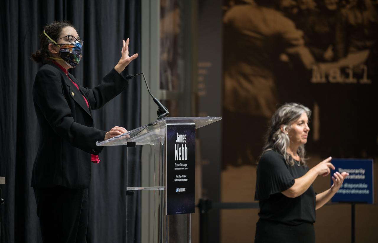 NASA’s Goddard Space Flight Center Webb Deputy Observatory Project Scientist, Erin Smith, provides remarks at the first-day-of-issue event for the United States Postal Service’s new stamp celebrating NASA’s James Webb Space Telescope (JWST) on Thursday, Sept. 8, 2022, at the Smithsonian’s National Postal Museum in Washington. The stamp, which features an illustration of the observatory, honors Webb’s mission to explore the unknown in our universe – solving mysteries in our solar system, looking beyond to distant worlds around other stars, and probing the structures and origins of our universe and our place in it. Photo Credit: (NASA/Aubrey Gemignani)