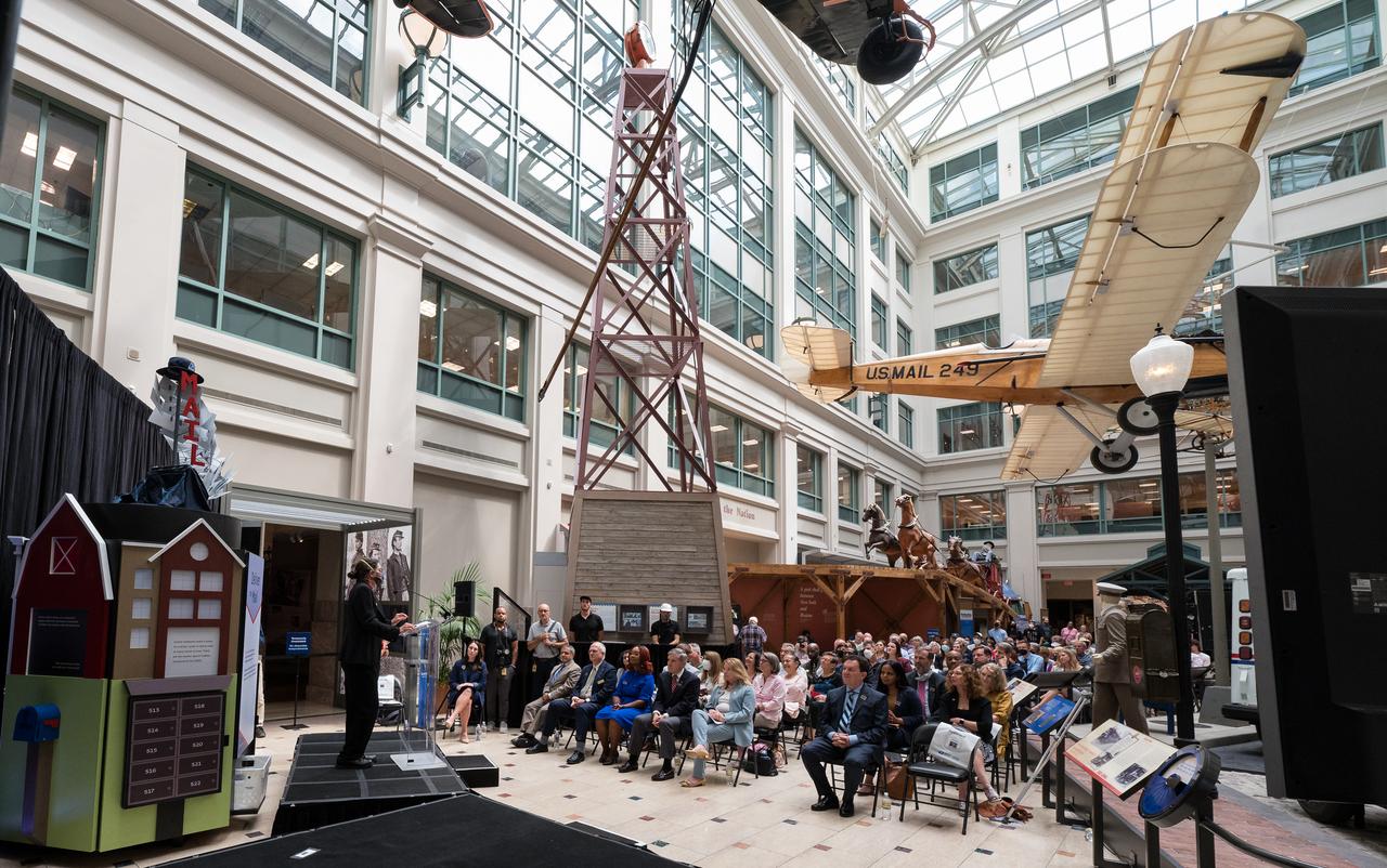NASA’s Goddard Space Flight Center Webb Deputy Observatory Project Scientist, Erin Smith, provides remarks at the first-day-of-issue event for the United States Postal Service’s new stamp celebrating NASA’s James Webb Space Telescope (JWST) on Thursday, Sept. 8, 2022, at the Smithsonian’s National Postal Museum in Washington. The stamp, which features an illustration of the observatory, honors Webb’s mission to explore the unknown in our universe – solving mysteries in our solar system, looking beyond to distant worlds around other stars, and probing the structures and origins of our universe and our place in it. Photo Credit: (NASA/Aubrey Gemignani)