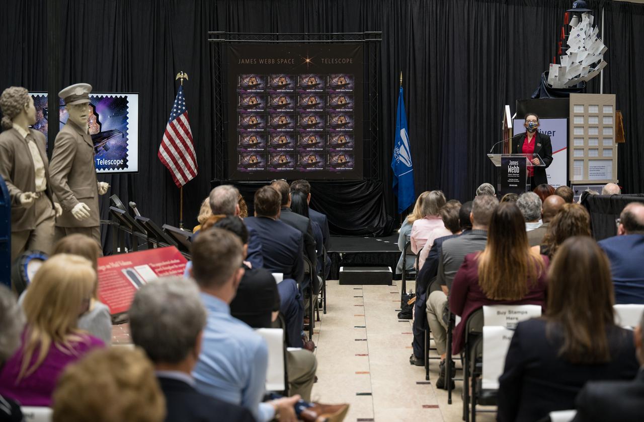 NASA’s Goddard Space Flight Center Webb Deputy Observatory Project Scientist, Erin Smith, provides remarks at the first-day-of-issue event for the United States Postal Service’s new stamp celebrating NASA’s James Webb Space Telescope (JWST) on Thursday, Sept. 8, 2022, at the Smithsonian’s National Postal Museum in Washington. The stamp, which features an illustration of the observatory, honors Webb’s mission to explore the unknown in our universe – solving mysteries in our solar system, looking beyond to distant worlds around other stars, and probing the structures and origins of our universe and our place in it. Photo Credit: (NASA/Aubrey Gemignani)