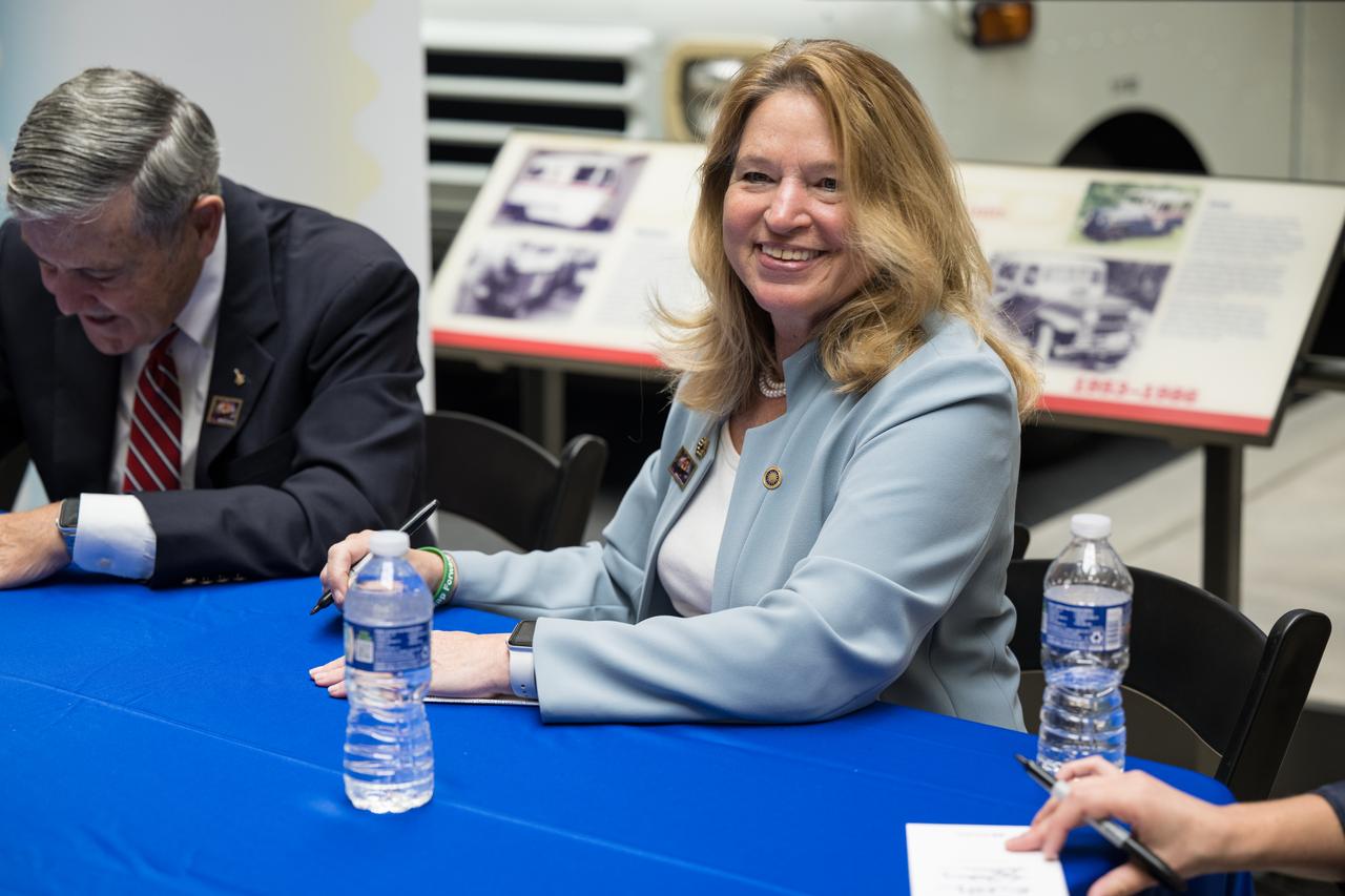 Smithsonian Institution Under Secretary for Service and Research, Ellen Stofan, autographs a piece of mail with the United States Postal Service’s new stamp celebrating NASA’s James Webb Space Telescope (JWST) on it, at the first-day-of-issue event, Thursday, Sept. 8, 2022, at the Smithsonian’s National Postal Museum in Washington. The stamp, which features an illustration of the observatory, honors Webb’s mission to explore the unknown in our universe – solving mysteries in our solar system, looking beyond to distant worlds around other stars, and probing the structures and origins of our universe and our place in it. Photo Credit: (NASA/Aubrey Gemignani)