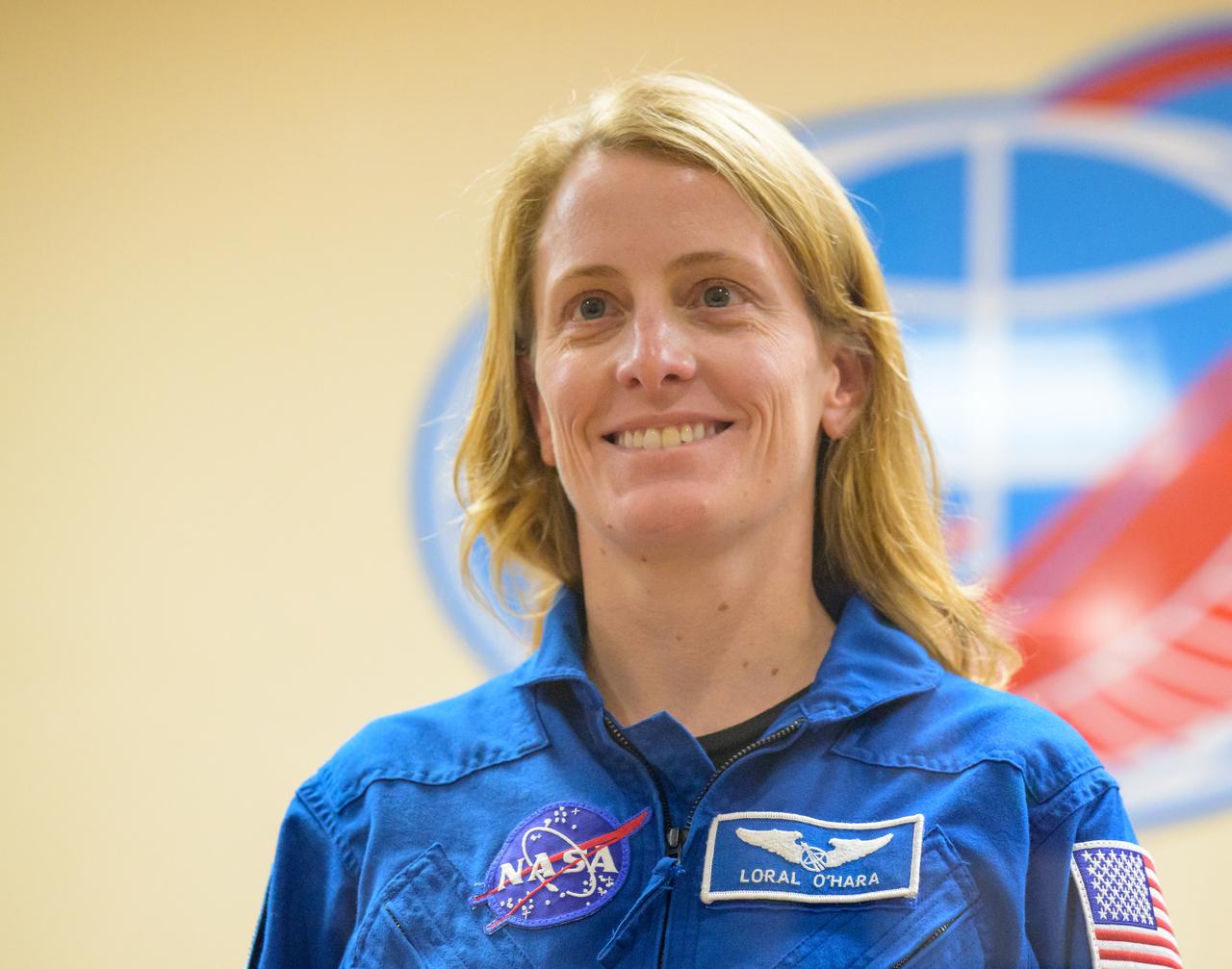Expedition 68 backup crewmember Loral O'Hara of NASA is seen in quarantine, behind glass, during a press conference, Tuesday, Sept. 20, 2022, at the Cosmonaut Hotel in Baikonur, Kazakhstan. Expedition 68 astronaut Frank Rubio of NASA, and cosmonauts Sergey Prokopyev and Dmitri Petelin of Roscosmos are scheduled to launch to the International Space Station aboard the Soyuz MS-22 spacecraft on Sept. 21. Photo Credit: (NASA/Bill Ingalls)