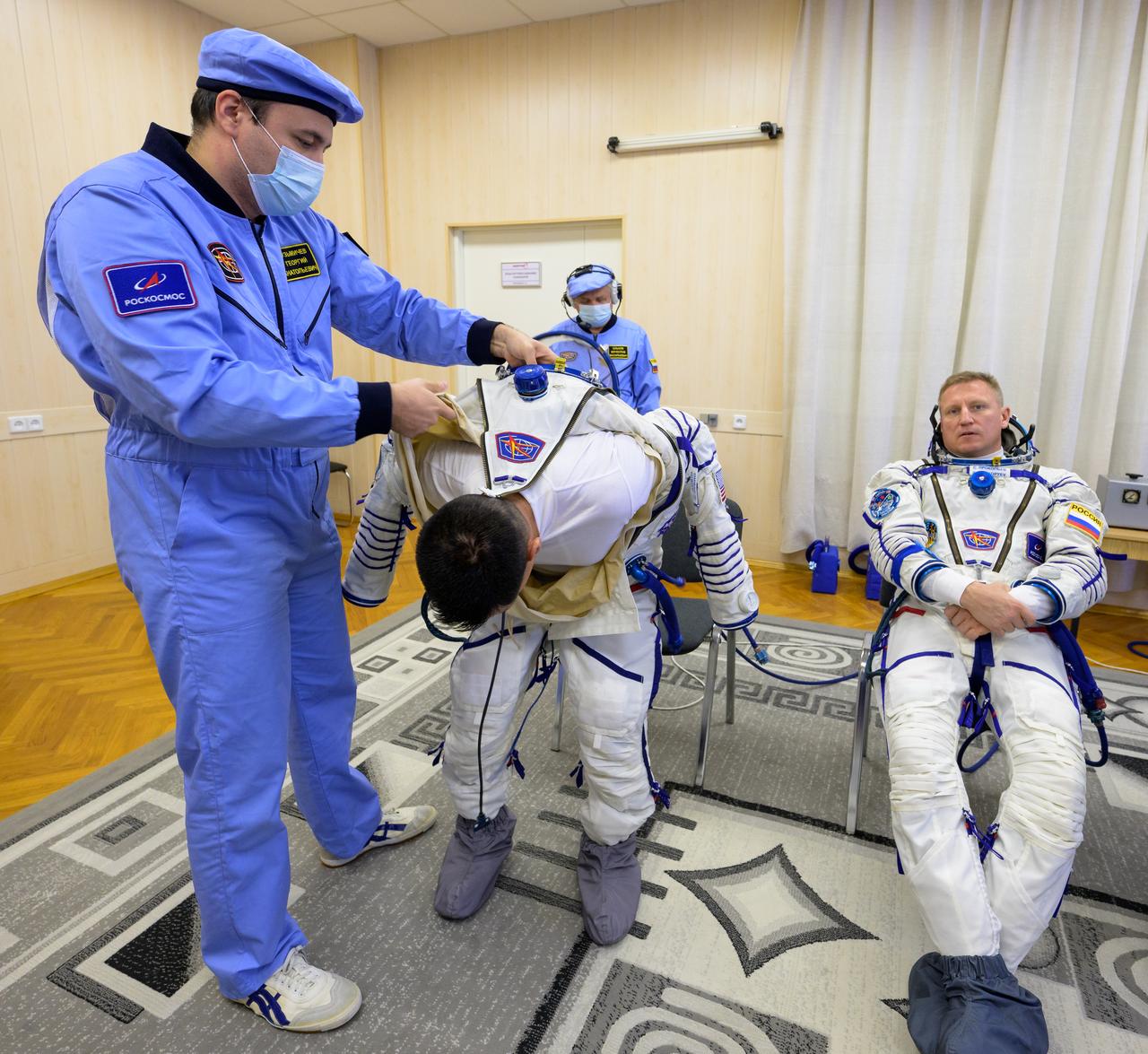 Expedition 68 astronaut Frank Rubio of NASA dons his Russian Sokol suit as he and fellow crewmates Sergey Prokopyev, right, and Dmitri Petelin of Roscosmos, prepare for their Soyuz MS-22 spacecraft launch, Wednesday, Sept. 21, 2022, in Baikonur, Kazakhstan. Rubio, Prokopyev and Petelin launched onboard the Soyuz rocket from the Baikonur Cosmodrome for a mission on the International Space Station. Photo Credit: (NASA/Bill Ingalls)
