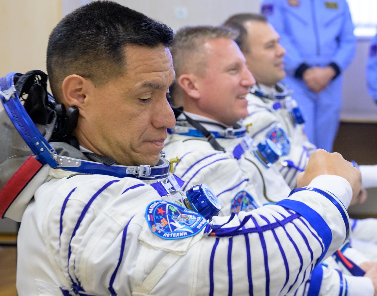Expedition 68 astronaut Frank Rubio of NASA, left, dons his Russian Sokol suit as he and fellow crewmates Sergey Prokopyev, and Dmitri Petelin of Roscosmos, right, prepare for their Soyuz MS-22 spacecraft launch, Wednesday, Sept. 21, 2022, in Baikonur, Kazakhstan. Rubio, Prokopyev and Petelin launched onboard the Soyuz rocket from the Baikonur Cosmodrome for a mission on the International Space Station. Photo Credit: (NASA/Bill Ingalls)