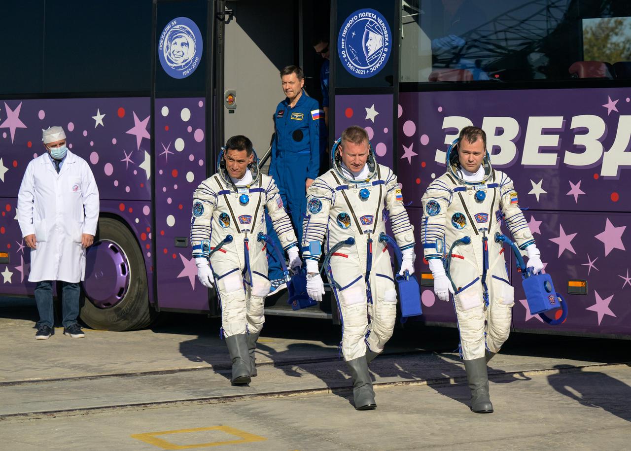 Expedition 68 astronaut Frank Rubio of NASA, left, and cosmonauts Sergey Prokopyev and Dmitri Petelin of Roscosmos, right, arrive at the launch pad to board their Soyuz MS-22 spacecraft for launch, Wednesday, Sept. 21, 2022, at the Baikonur Cosmodrome in Kazakhstan. Rubio, Prokopyev and Petelin launched onboard the Soyuz rocket from the Baikonur Cosmodrome for a mission on the International Space Station. Photo Credit: (NASA/Bill Ingalls)