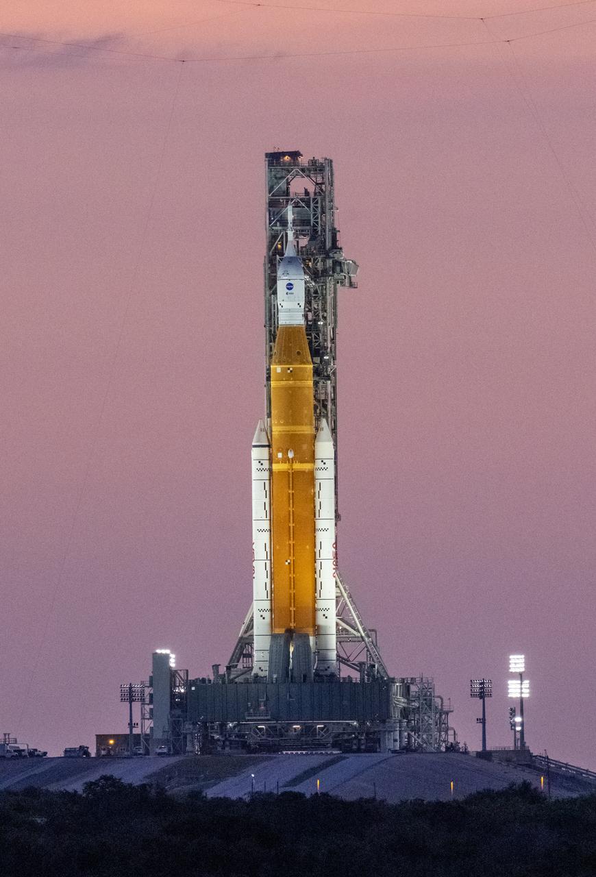 NASA’s Space Launch System (SLS) rocket with the Orion spacecraft aboard is seen atop the mobile launcher at Launch Pad 39B as teams configure systems for rolling back to the Vehicle Assembly Building, Monday, Sept. 26, 2022, at NASA’s Kennedy Space Center in Florida. NASA made the decision to rollback based on the latest weather predictions associated with Hurricane Ian. NASA’s Artemis I flight test is the first integrated test of the agency’s deep space exploration systems: the Orion spacecraft, SLS rocket, and supporting ground systems. Photo Credit: (NASA/Keegan Barber)
