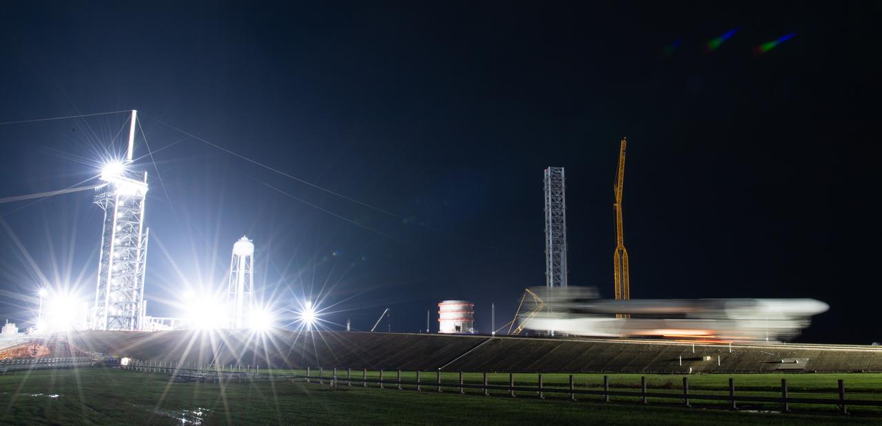 In this three-minute exposure, a SpaceX Falcon 9 rocket with the company's Crew Dragon spacecraft onboard is seen as it is rolled out to the launch pad at Launch Complex 39A as preparations continue for the Crew-5 mission, Saturday, Oct. 1, 2022, at NASA’s Kennedy Space Center in Florida. NASA’s SpaceX Crew-5 mission is the fifth crew rotation mission of the SpaceX Crew Dragon spacecraft and Falcon 9 rocket to the International Space Station as part of the agency’s Commercial Crew Program. NASA astronauts Nicole Mann and Josh Cassada, Japan Aerospace Exploration Agency (JAXA) astronaut Koichi Wakata, and Roscosmos cosmonaut Anna Kikina are scheduled to launch at 12:00 p.m. EDT on Oct. 5, from Launch Complex 39A at the Kennedy Space Center. Photo Credit: (NASA/Joel Kowsky)
