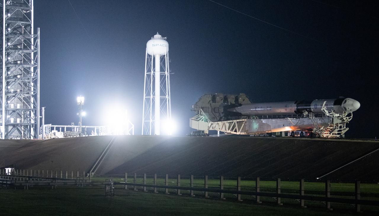 A SpaceX Falcon 9 rocket with the company's Crew Dragon spacecraft onboard is seen as it is rolled out to the launch pad at Launch Complex 39A as preparations continue for the Crew-5 mission, Saturday, Oct. 1, 2022, at NASA’s Kennedy Space Center in Florida. NASA’s SpaceX Crew-5 mission is the fifth crew rotation mission of the SpaceX Crew Dragon spacecraft and Falcon 9 rocket to the International Space Station as part of the agency’s Commercial Crew Program. NASA astronauts Nicole Mann and Josh Cassada, Japan Aerospace Exploration Agency (JAXA) astronaut Koichi Wakata, and Roscosmos cosmonaut Anna Kikina are scheduled to launch at 12:00 p.m. EDT on Oct. 5, from Launch Complex 39A at the Kennedy Space Center. Photo Credit: (NASA/Joel Kowsky)