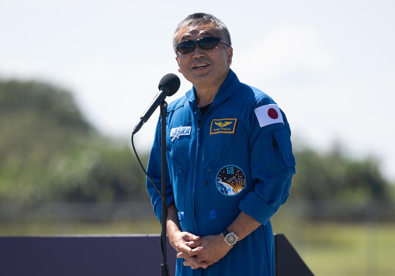 Japan Aerospace Exploration Agency (JAXA) astronaut Koichi Wakata speaks to members of the media after arriving at the Launch and Landing Facility with fellow crewmembers NASA astronauts Nicole Mann and Josh Cassada and Roscosmos cosmonaut Anna Kikina, at NASA’s Kennedy Space Center ahead of SpaceX’s Crew-5 mission, Saturday, Oct. 1, 2022, in Florida. NASA’s SpaceX Crew-5 mission is the fifth crew rotation mission of the SpaceX Crew Dragon spacecraft and Falcon 9 rocket to the International Space Station as part of the agency’s Commercial Crew Program. Mann, Cassada, Wakata, and Kikini are scheduled to launch at 12:00 p.m. EDT on Oct. 5, from Launch Complex 39A at the Kennedy Space Center. Photo Credit: (NASA/Joel Kowsky)
