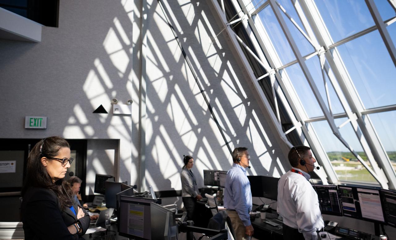 Emily Nelson, NASA's chief flight director, left, Ven Feng, deputy program manager for NASA's Commercial Crew Program, second from right, and Richard Jones, manager of the Mission Management and Integration Office for NASA's Commercial Crew Program, right, monitor the countdown during a dress rehearsal in preparation for the launch of a SpaceX Falcon 9 rocket carrying the company's Crew Dragon spacecraft on NASA’s SpaceX Crew-5 mission with NASA astronauts Nicole Mann and Josh Cassada, Japan Aerospace Exploration Agency (JAXA) astronaut Koichi Wakata, and Roscosmos cosmonaut Anna Kikina onboard, Sunday, Oct. 2, 2022, in firing room four of the Rocco A. Petrone Launch Control Center at NASA’s Kennedy Space Center in Florida. NASA’s SpaceX Crew-5 mission is the fifth crew rotation mission of the SpaceX Crew Dragon spacecraft and Falcon 9 rocket to the International Space Station as part of the agency’s Commercial Crew Program. Mann, Cassada, Wakata, and Kikini are scheduled to launch at 12:00 p.m. EDT on Oct. 5, from Launch Complex 39A at the Kennedy Space Center. Photo Credit: (NASA/Joel Kowsky)