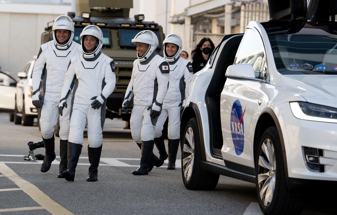 NASA astronauts Josh Cassada, left, and Nicole Mann, second from left, Japan Aerospace Exploration Agency (JAXA) astronaut Koichi Wakata, second from right, and Roscosmos cosmonaut Anna Kikina, right, wearing SpaceX spacesuits, are seen as they prepare to depart the Neil  A. Armstrong Operations and Checkout Building for Launch Complex 39A during a dress rehearsal prior to the Crew-5 mission launch, Sunday, Oct. 2, 2022, at NASA’s Kennedy Space Center in Florida. NASA’s SpaceX Crew-5 mission is the fifth crew rotation mission of the SpaceX Crew Dragon spacecraft and Falcon 9 rocket to the International Space Station as part of the agency’s Commercial Crew Program. Mann, Cassada, Wakata, and Kikini are scheduled to launch at 12:00 p.m. EDT on Oct. 5, from Launch Complex 39A at the Kennedy Space Center. Photo Credit: (NASA/Joel Kowsky)