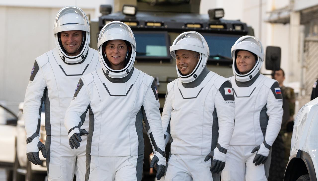 NASA astronauts Josh Cassada, left, and Nicole Mann, second from left, Japan Aerospace Exploration Agency (JAXA) astronaut Koichi Wakata, second from right, and Roscosmos cosmonaut Anna Kikina, right, wearing SpaceX spacesuits, are seen as they prepare to depart the Neil  A. Armstrong Operations and Checkout Building for Launch Complex 39A during a dress rehearsal prior to the Crew-5 mission launch, Sunday, Oct. 2, 2022, at NASA’s Kennedy Space Center in Florida. NASA’s SpaceX Crew-5 mission is the fifth crew rotation mission of the SpaceX Crew Dragon spacecraft and Falcon 9 rocket to the International Space Station as part of the agency’s Commercial Crew Program. Mann, Cassada, Wakata, and Kikini are scheduled to launch at 12:00 p.m. EDT on Oct. 5, from Launch Complex 39A at the Kennedy Space Center. Photo Credit: (NASA/Joel Kowsky)