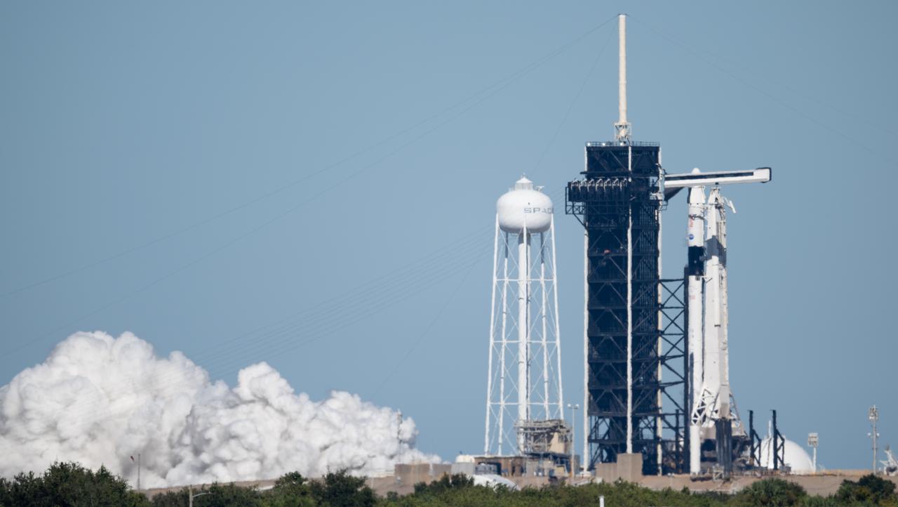 A SpaceX Falcon 9 rocket with the company's Crew Dragon spacecraft onboard is seen on the launch pad at Launch Complex 39A during a brief static fire test ahead of NASA’s SpaceX Crew-5 mission, Sunday, Oct. 2, 2022, at NASA’s Kennedy Space Center in Florida. NASA’s SpaceX Crew-5 mission is the fifth crew rotation mission of the SpaceX Crew Dragon spacecraft and Falcon 9 rocket to the International Space Station as part of the agency’s Commercial Crew Program. NASA astronauts Nicole Mann and Josh Cassada, Japan Aerospace Exploration Agency (JAXA) astronaut Koichi Wakata, and Roscosmos cosmonaut Anna Kikina are scheduled to launch at 12:00 p.m. EDT on Oct. 5 from Launch Complex 39A at the Kennedy Space Center. Photo Credit: (NASA/Joel Kowsky)