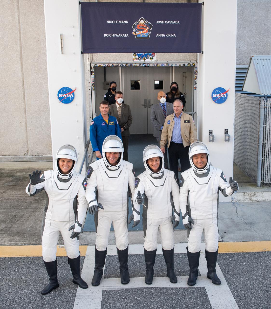 Roscosmos cosmonaut Anna Kikina, left, NASA astronaut Josh Cassada, second from left, NASA astronaut Nicole Mann, second from right, and Japan Aerospace Exploration Agency (JAXA) astronaut Koichi Wakata, right, are seen as they prepare to depart the Neil  A. Armstrong Operations and Checkout Building for Launch Complex 39A to board the SpaceX Crew Dragon spacecraft for the Crew-5 mission launch, Wednesday, Oct. 5, 2022, at NASA’s Kennedy Space Center in Florida. NASA’s SpaceX Crew-5 mission is the fifth crew rotation mission of the SpaceX Crew Dragon spacecraft and Falcon 9 rocket to the International Space Station as part of the agency’s Commercial Crew Program. Mann, Cassada, Wakata, and Kikini are scheduled to launch at 12:00 p.m. EDT, from Launch Complex 39A at the Kennedy Space Center.  Photo Credit: (NASA/Joel Kowsky)