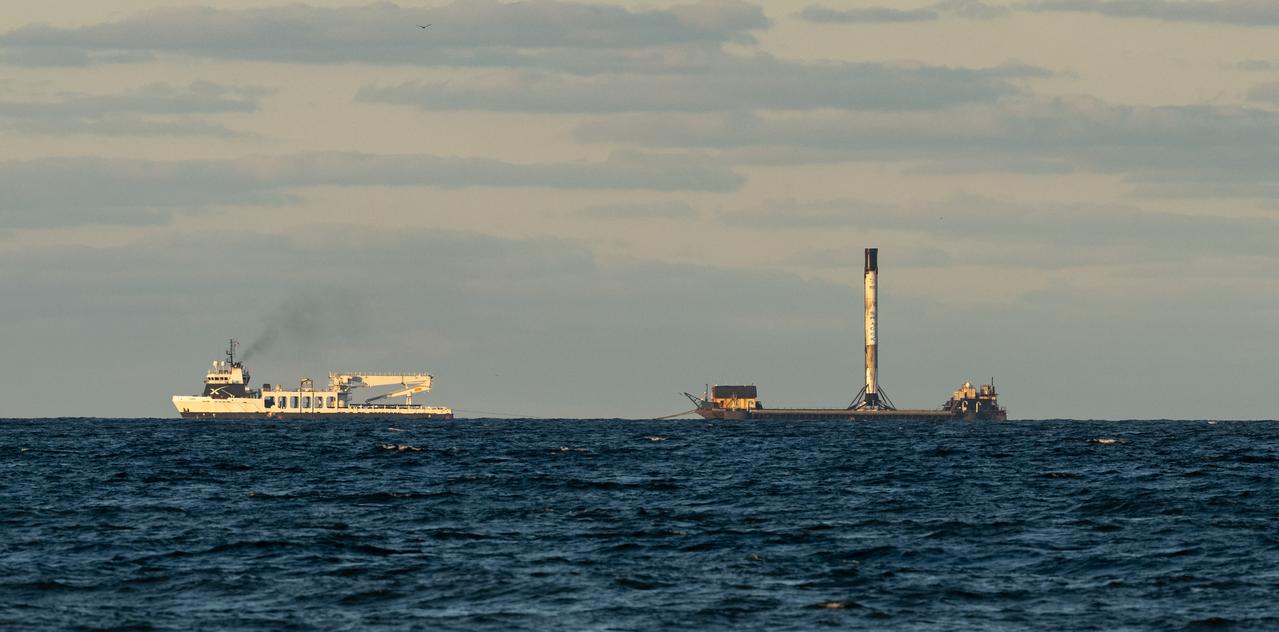 The Falcon 9 rocket booster used for NASA’s SpaceX Crew-5 launch sits atop the autonomous spaceport drone ship (ASDS), named Just Read the Instructions (JRTI), as it is towed into Port Canaveral by the SpaceX multi-purpose recovery ship Doug, Saturday, Oct. 8, 2022, in Cape Canaveral, Florida. NASA’s SpaceX Crew-5 mission is the fifth crew rotation mission of the SpaceX Crew Dragon spacecraft and Falcon 9 rocket to the International Space Station as part of the agency’s Commercial Crew Program. NASA astronauts Nicole Mann and Josh Cassada, Japan Aerospace Exploration Agency (JAXA) astronaut Koichi Wakata, and Roscosmos cosmonaut Anna Kikina launched on Oct. 5 from Launch Complex 39A at the Kennedy Space Center.  Photo Credit: (NASA/Bill Ingalls)