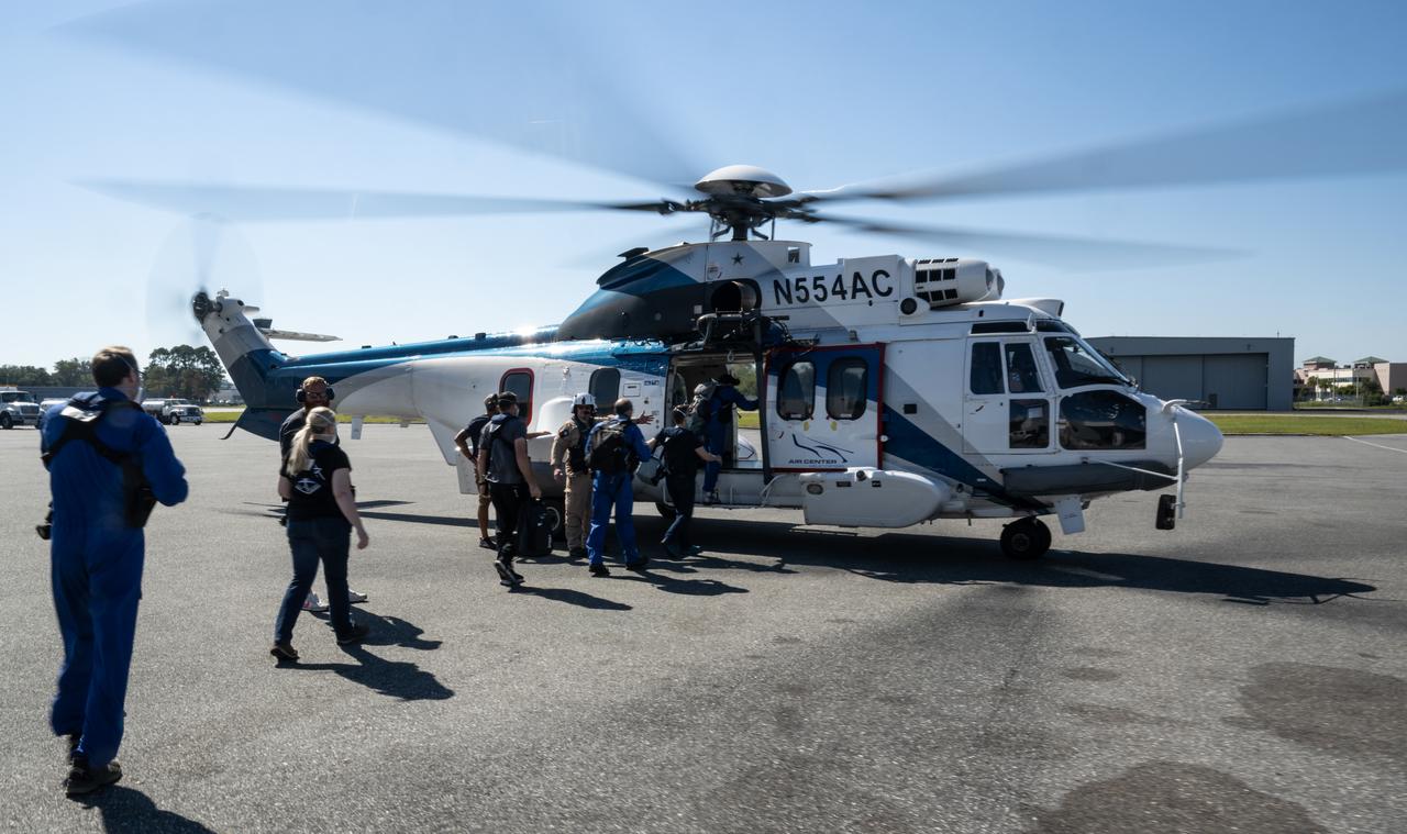 NASA, ESA (European Space Agency), and SpaceX support teams board a helicopter to stage for the landing of the SpaceX Crew Dragon Freedom spacecraft with NASA astronauts Kjell Lindgren, Robert Hines, Jessica Watkins, and ESA (European Space Agency) astronaut Samantha Cristoforetti aboard, Friday, Oct. 14, 2022, in Jacksonville, Florida. Lindgren, Hines, Watkins, and Cristoforetti are landing in the Atlantic Ocean after 170 days in space as part of Expeditions 67 and 68 aboard the International Space Station. Photo Credit: (NASA/Bill Ingalls)