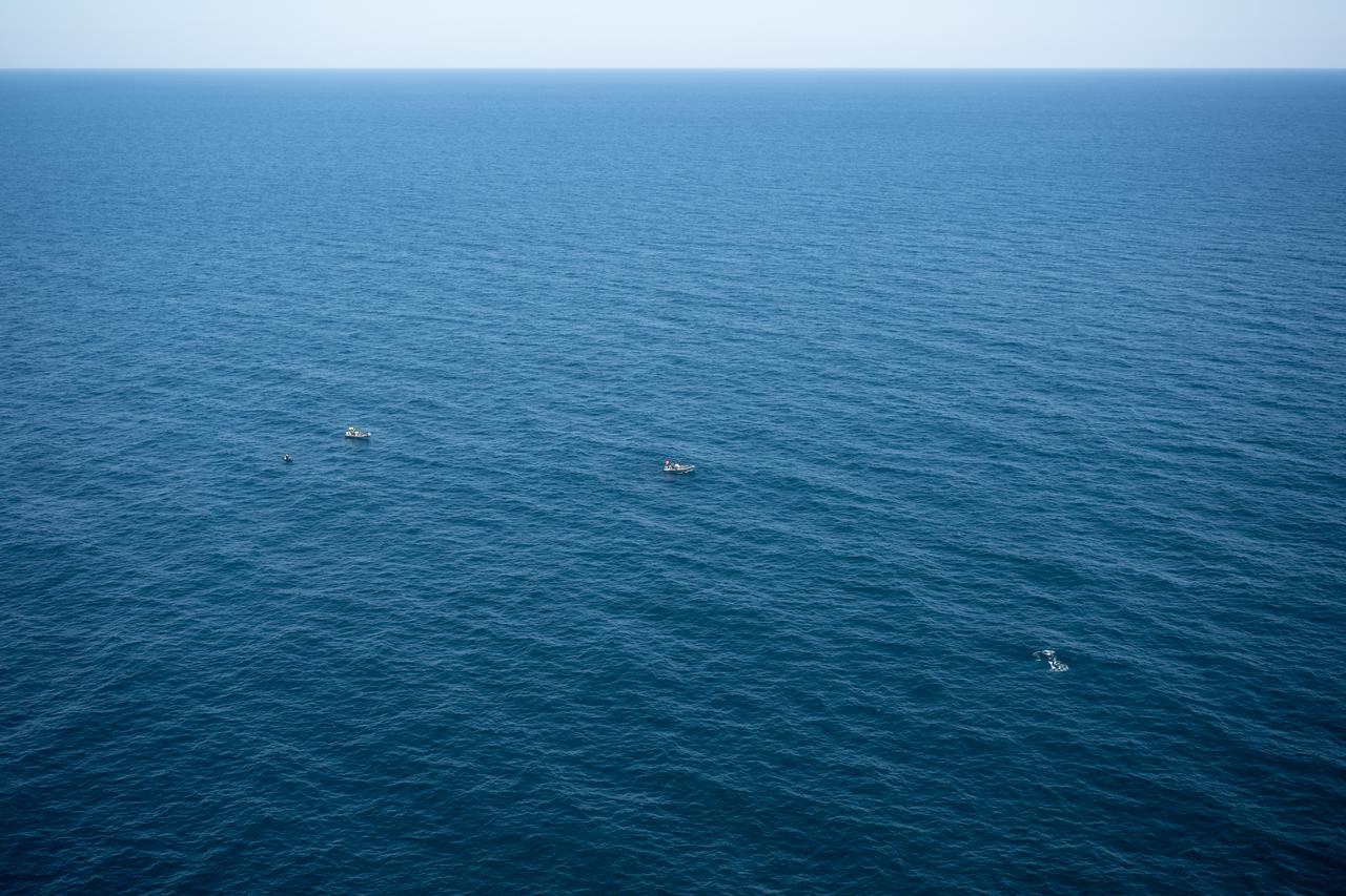 SpaceX fast boat teams are seen in the Atlantic Ocean as NASA, ESA (European Space Agency), and SpaceX teams prepare for the landing of the SpaceX Crew Dragon Freedom spacecraft with NASA astronauts Kjell Lindgren, Robert Hines, Jessica Watkins, and ESA (European Space Agency) astronaut Samantha Cristoforetti aboard, Friday, Oct. 14, 2022, off the coast of Jacksonville, Florida. Lindgren, Hines, Watkins, and Cristoforetti are returning after 170 days in space as part of Expeditions 67 and 68 aboard the International Space Station. Photo Credit: (NASA/Bill Ingalls)