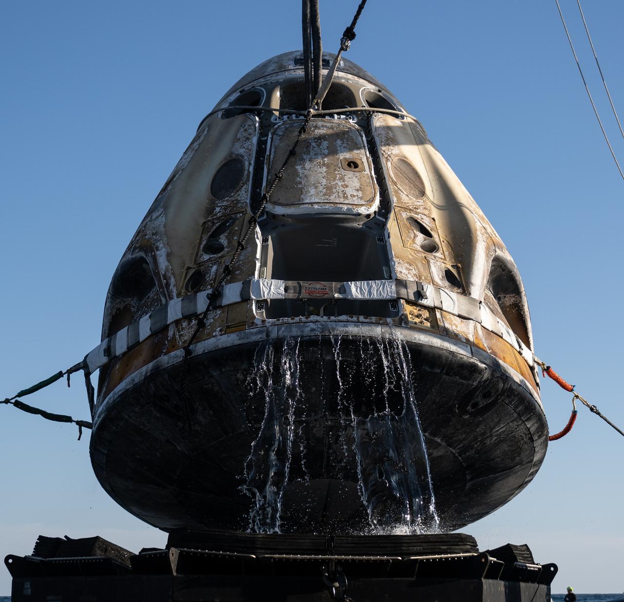 Support teams raise the SpaceX Crew Dragon Freedom spacecraft aboard the recovery ship Megan shortly after it landed with NASA astronauts Kjell Lindgren, Robert Hines, Jessica Watkins, and ESA (European Space Agency) astronaut Samantha Cristoforetti aboard in the Atlantic Ocean off the coast of Jacksonville, Florida, Friday, Oct. 14, 2022. Lindgren, Hines, Watkins, and Cristoforetti are returning after 170 days in space as part of Expeditions 67 and 68 aboard the International Space Station. Photo Credit: (NASA/Bill Ingalls)