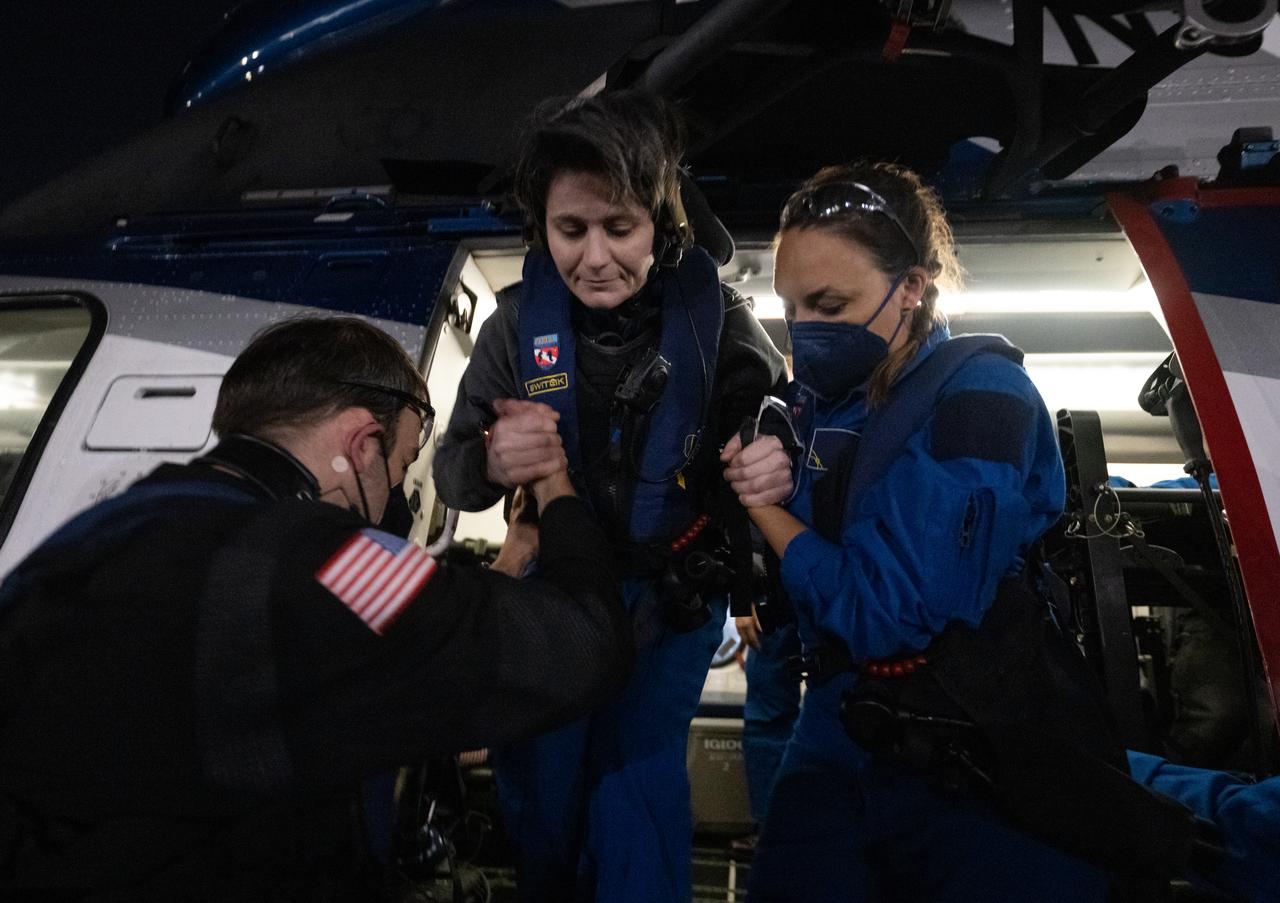 ESA (European Space Agency) astronaut Samantha Cristoforetti is helped out of a helicopter in Jacksonville, Florida just a few hours after she and NASA astronauts Kjell Lindgren, Jessica Watkins and Robert Hines landed in their SpaceX Crew Dragon Freedom spacecraft in the Atlantic Ocean off the coast of Jacksonville, Florida, Friday, Oct. 14, 2022. Lindgren, Hines, Watkins, and Cristoforetti are returning after 170 days in space as part of Expeditions 67 and 68 aboard the International Space Station. Photo Credit: (NASA/Bill Ingalls)