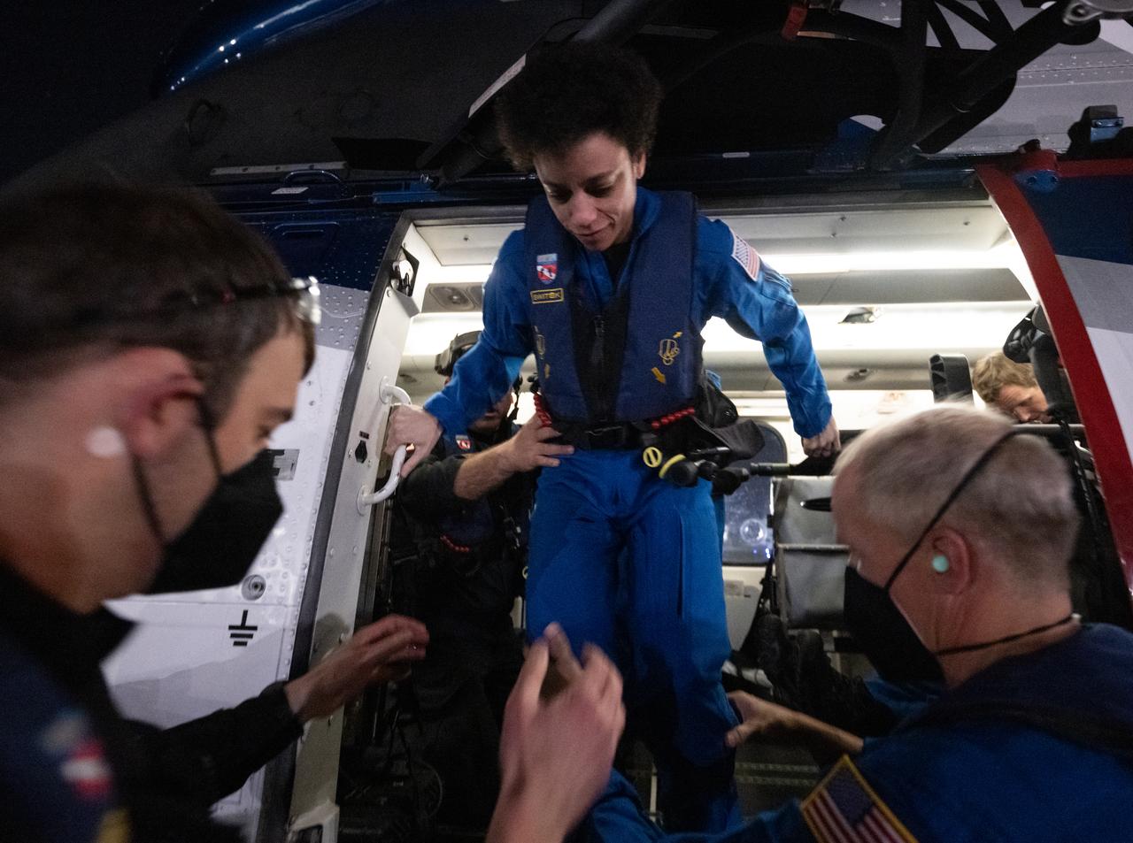 NASA astronaut Jessica Watkins is helped out of a helicopter in Jacksonville, Florida just a few hours after she and NASA astronauts Kjell Lindgren and Robert Hines, along with ESA (European Space Agency) astronaut Samantha Cristoforetti, landed in their SpaceX Crew Dragon Freedom spacecraft in the Atlantic Ocean off the coast of Jacksonville, Florida, Friday, Oct. 14, 2022. Lindgren, Hines, Watkins, and Cristoforetti are returning after 170 days in space as part of Expeditions 67 and 68 aboard the International Space Station. Photo Credit: (NASA/Bill Ingalls)