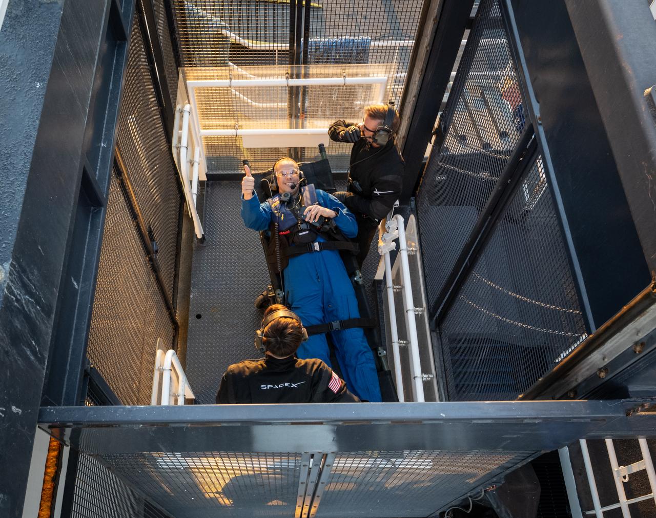 NASA astronaut Robert Hines is seen inside an elevator on the SpaceX recovery ship Megan that will take him up to a waiting helicopter to fly to Jacksonville, Florida with NASA astronauts Kjell Lindgren, and Jessica Watkins, along with ESA (European Space Agency) astronaut Samantha Cristoforetti, just a couple of hours after the four landed in their SpaceX Crew Dragon Freedom spacecraft in the Atlantic Ocean, Friday, Oct. 14, 2022. Lindgren, Hines, Watkins, and Cristoforetti are returning after 170 days in space as part of Expeditions 67 and 68 aboard the International Space Station. Photo Credit: (NASA/Bill Ingalls)