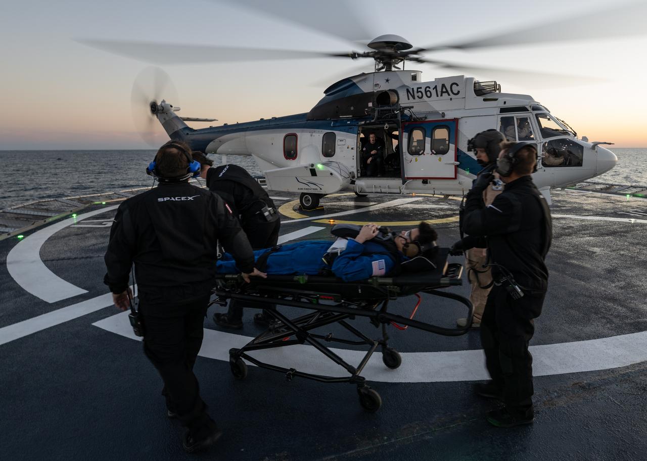 NASA astronaut Jessica Watkins is helped aboard a helicopter on the SpaceX recovery ship Megan to fly to Jacksonville, Florida with NASA astronauts Robert Hines and Kjell Lindgren, along with ESA (European Space Agency) astronaut Samantha Cristoforetti, after the four landed in their SpaceX Crew Dragon Freedom spacecraft in the Atlantic Ocean off the coast of Jacksonville, Friday, Oct. 14, 2022. Lindgren, Hines, Watkins, and Cristoforetti are returning after 170 days in space as part of Expeditions 67 and 68 aboard the International Space Station. Photo Credit: (NASA/Bill Ingalls)