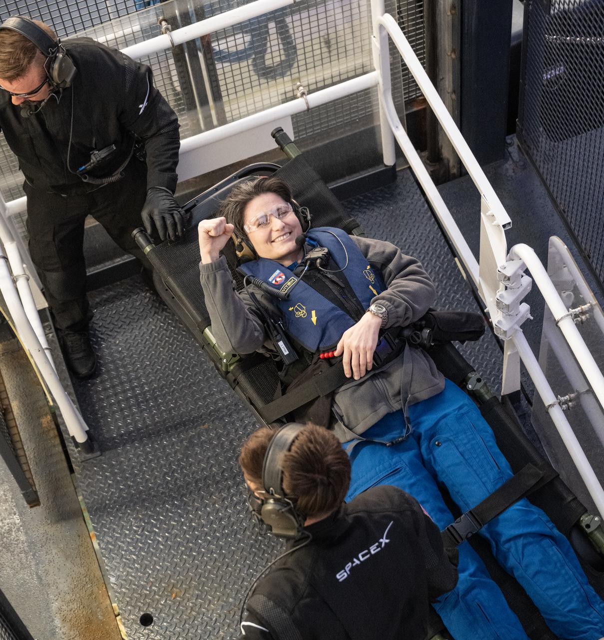 ESA (European Space Agency) astronaut Samantha Cristoforetti is seen inside an elevator on the SpaceX recovery ship Megan that will take her up to a waiting helicopter to fly to Jacksonville, Florida with NASA astronauts Kjell Lindgren, Robert Hines and Jessica Watkins, just a couple of hours after the four landed in their SpaceX Crew Dragon Freedom spacecraft in the Atlantic Ocean, Friday, Oct. 14, 2022. Lindgren, Hines, Watkins, and Cristoforetti are returning after 170 days in space as part of Expeditions 67 and 68 aboard the International Space Station. Photo Credit: (NASA/Bill Ingalls)