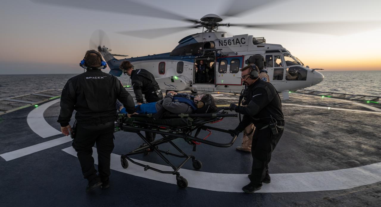 ESA (European Space Agency) astronaut Samantha Cristoforetti is helped aboard a helicopter on the SpaceX recovery ship Megan to fly to Jacksonville, Florida with NASA astronauts Kjell Lindgren, Robert Hines and Jessica Watkins, after the four landed in their SpaceX Crew Dragon Freedom spacecraft in the Atlantic Ocean off the coast of Jacksonville, Friday, Oct. 14, 2022. Lindgren, Hines, Watkins, and Cristoforetti are returning after 170 days in space as part of Expeditions 67 and 68 aboard the International Space Station. Photo Credit: (NASA/Bill Ingalls)