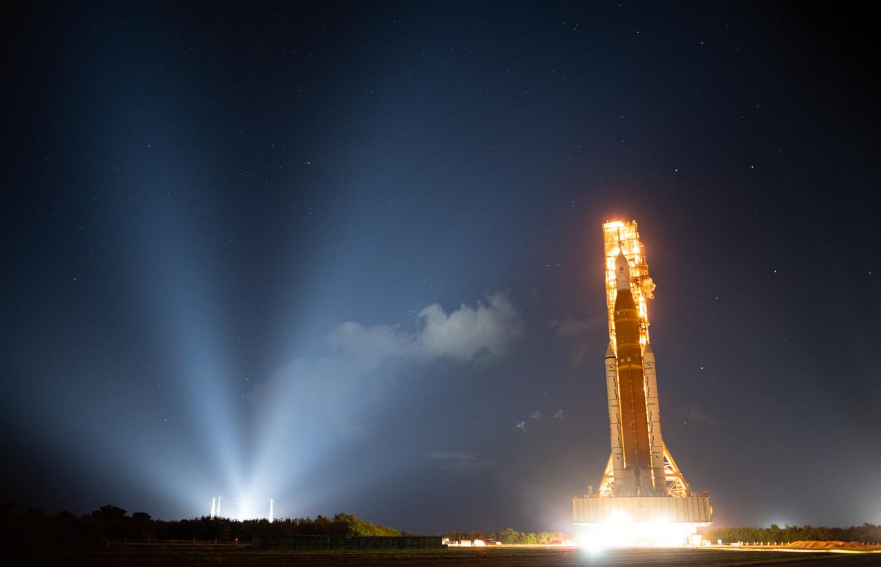 NASA’s Space Launch System (SLS) rocket with the Orion spacecraft aboard is seen atop the mobile launcher as it rolls out to Launch Pad 39B, Friday, Nov. 4, 2022, at NASA’s Kennedy Space Center in Florida. NASA’s Artemis I flight test is the first integrated test of the agency’s deep space exploration systems: the Orion spacecraft, SLS rocket, and supporting ground systems. Launch of the uncrewed flight test is targeted for Nov. 14 at 12:07 a.m. EST. Photo Credit: (NASA/Joel Kowsky)