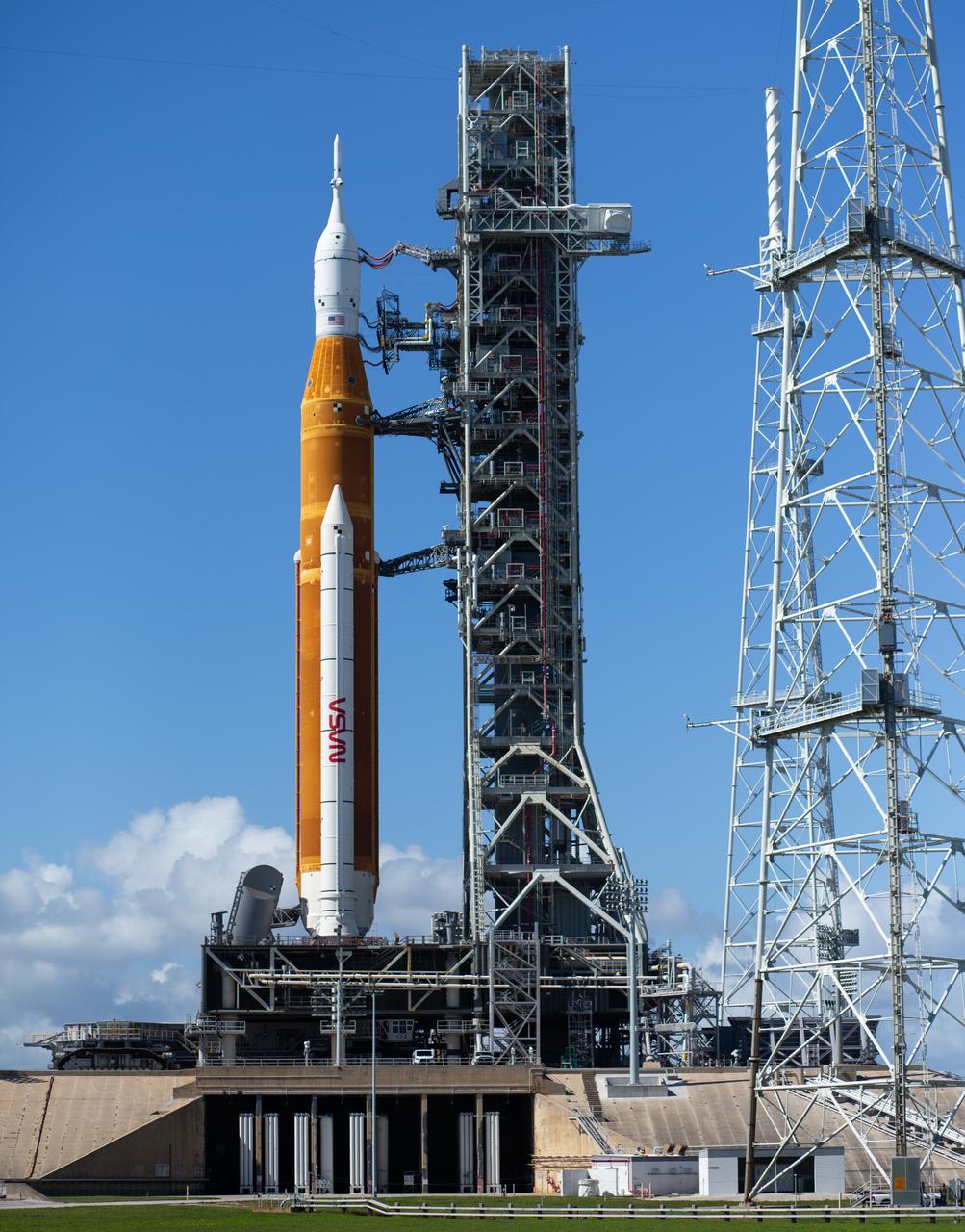 NASA’s Space Launch System (SLS) rocket with the Orion spacecraft aboard is seen atop a mobile launcher at Launch Pad 39B as Crawler Transporter-2 (CT-2) begins to depart the pad, Friday, Nov. 4, 2022, after being rolled out to the launch pad at NASA’s Kennedy Space Center in Florida. NASA’s Artemis I mission is the first integrated test of the agency’s deep space exploration systems: the Orion spacecraft, SLS rocket, and supporting ground systems. Launch of the uncrewed flight test is targeted for Nov. 14 at 12:07 a.m. EST. Photo Credit: (NASA/Joel Kowsky)