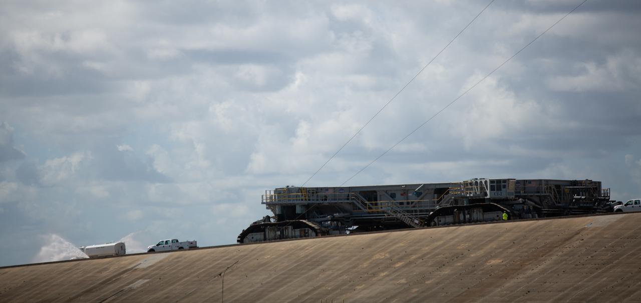 Crawler Transporter-2 (CT-2) is seen moving down the ramp at Launch Pad 39B after transporting NASA’s Space Launch System (SLS) rocket with the Orion spacecraft aboard atop the mobile launcher to the pad, Friday, Nov. 4, 2022, at NASA’s Kennedy Space Center in Florida. NASA’s Artemis I mission is the first integrated test of the agency’s deep space exploration systems: the Orion spacecraft, SLS rocket, and supporting ground systems. Launch of the uncrewed flight test is targeted for Nov. 14 at 12:07 a.m. EST. Photo Credit: (NASA/Joel Kowsky)