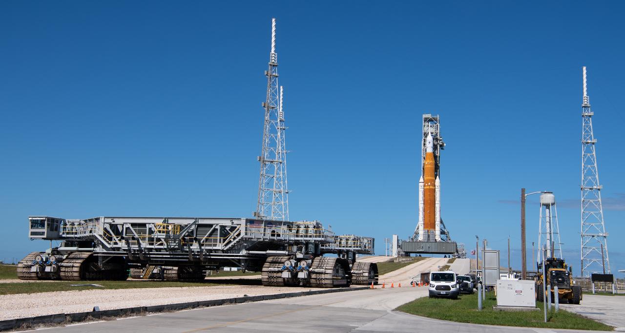 NASA’s Space Launch System (SLS) rocket with the Orion spacecraft aboard is seen atop a mobile launcher at Launch Pad 39B, Friday, Nov. 4, 2022, as Crawler Transporter-2 departs the pad following rollout at NASA’s Kennedy Space Center in Florida. NASA’s Artemis I mission is the first integrated test of the agency’s deep space exploration systems: the Orion spacecraft, SLS rocket, and supporting ground systems. Launch of the uncrewed flight test is targeted for Nov. 14 at 12:07 a.m. EST. Photo Credit: (NASA/Joel Kowsky)