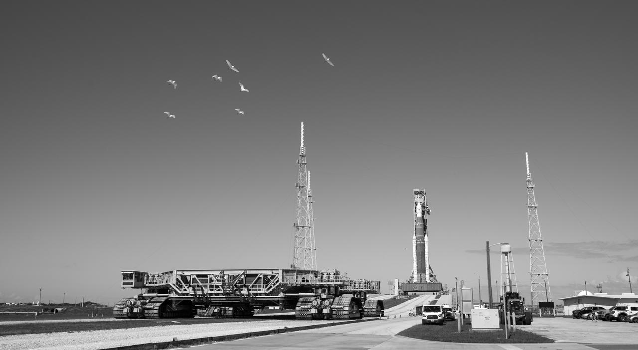 NASA’s Space Launch System (SLS) rocket with the Orion spacecraft aboard is seen atop a mobile launcher at Launch Pad 39B, Friday, Nov. 4, 2022, as Crawler Transporter-2 departs the pad following rollout at NASA’s Kennedy Space Center in Florida. NASA’s Artemis I mission is the first integrated test of the agency’s deep space exploration systems: the Orion spacecraft, SLS rocket, and supporting ground systems. Launch of the uncrewed flight test is targeted for Nov. 14 at 12:07 a.m. EST. Photo Credit: (NASA/Joel Kowsky)