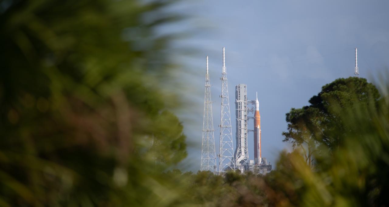 NASA’s Space Launch System (SLS) rocket with the Orion spacecraft aboard is seen atop a mobile launcher at Launch Pad 39B as preparations for launch continue, Saturday, Nov. 5, 2022, at NASA’s Kennedy Space Center in Florida. NASA’s Artemis I flight test is the first integrated test of the agency’s deep space exploration systems: the Orion spacecraft, SLS rocket, and supporting ground systems. Launch of the uncrewed flight test is targeted for Nov. 14 at 12:07 a.m. EST.  Photo Credit: (NASA/Joel Kowsky)